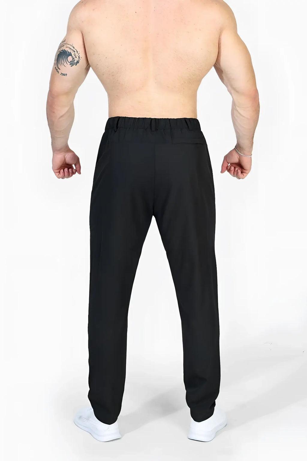 Jed North quick-dry tech pants in black with elastic waistband and sleek tapered fit made for athletic use