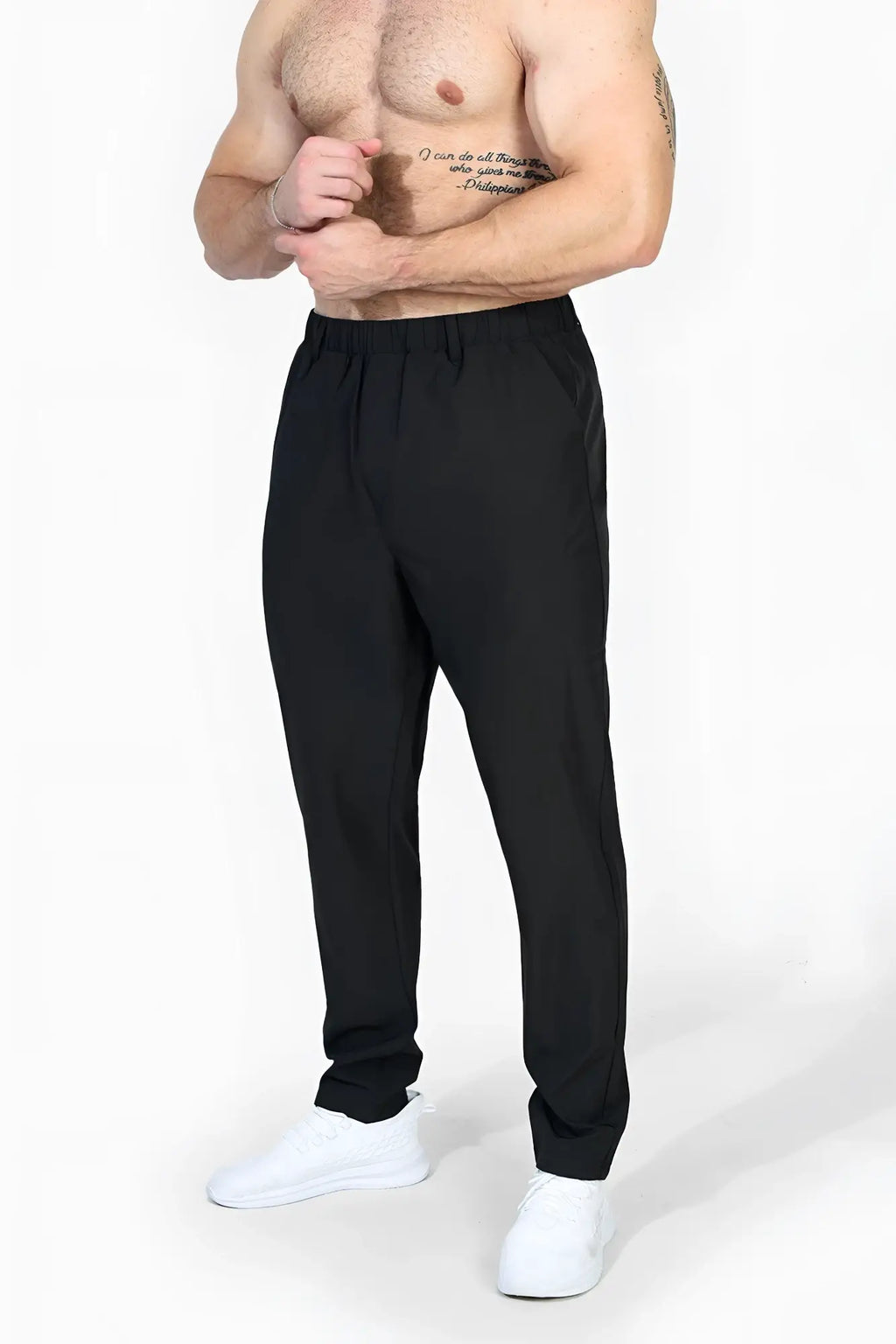 Black jed north quick dry tech pants featuring elastic waistband tapered legs designed for athletic use