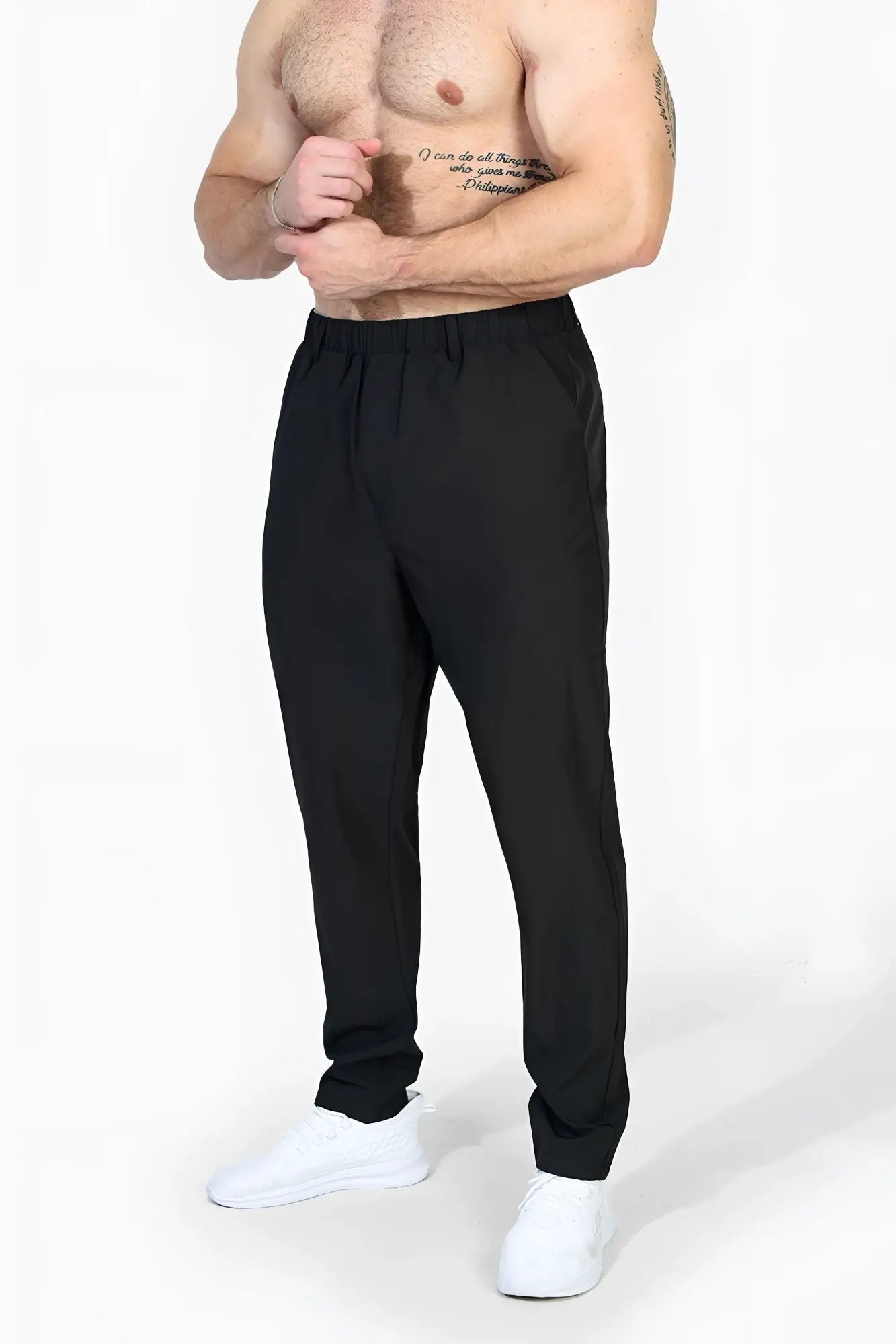 Black jed north quick dry tech pants featuring elastic waistband tapered legs designed for athletic use