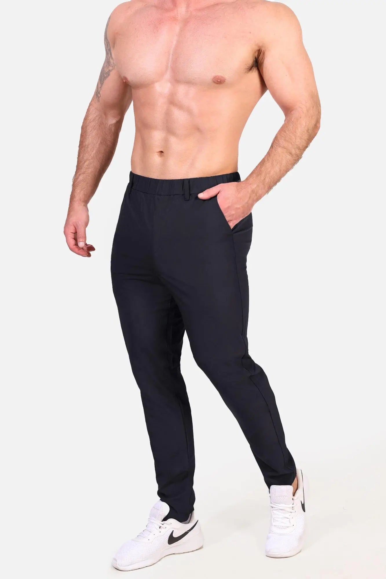 Black slim-fit jed north quick-dry tech pants with sleek modern design and subtle side seam detailing