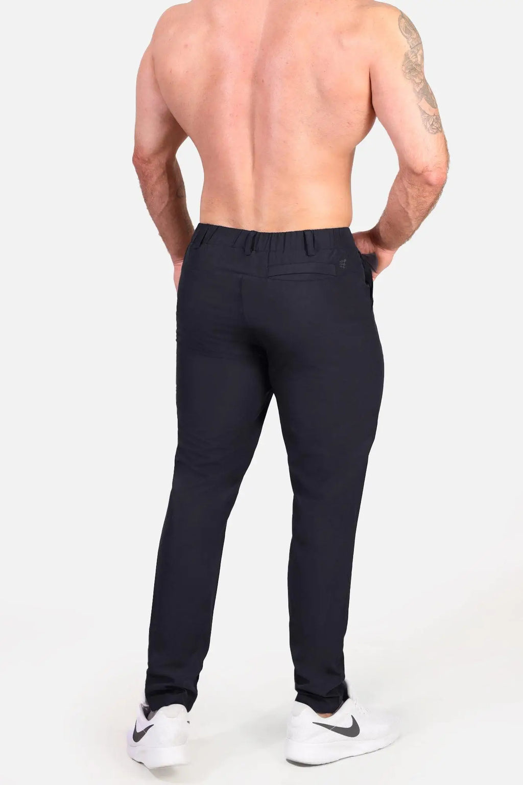 Black Jed North quick-dry tech slim-fit trousers with tailored waistband and subtle stitching details