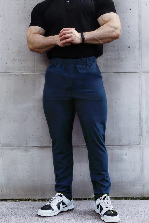 Navy blue Jed North quick-dry tech pants with elastic waistband and subtle side pockets for athletic use