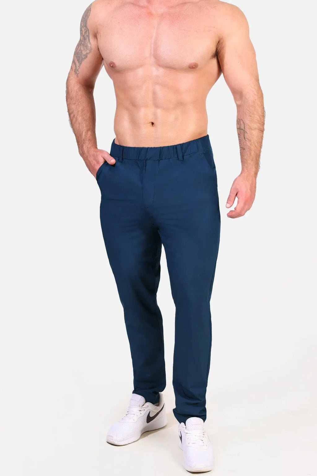 Dark blue slim-fit Jed North quick-dry tech pants with tailored waistband and side pockets for active wear
