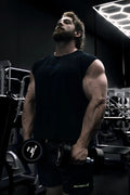 Black dumbbell with matte finish and white branding on the weight plates shown with raglan sleeveless muscle tank all black