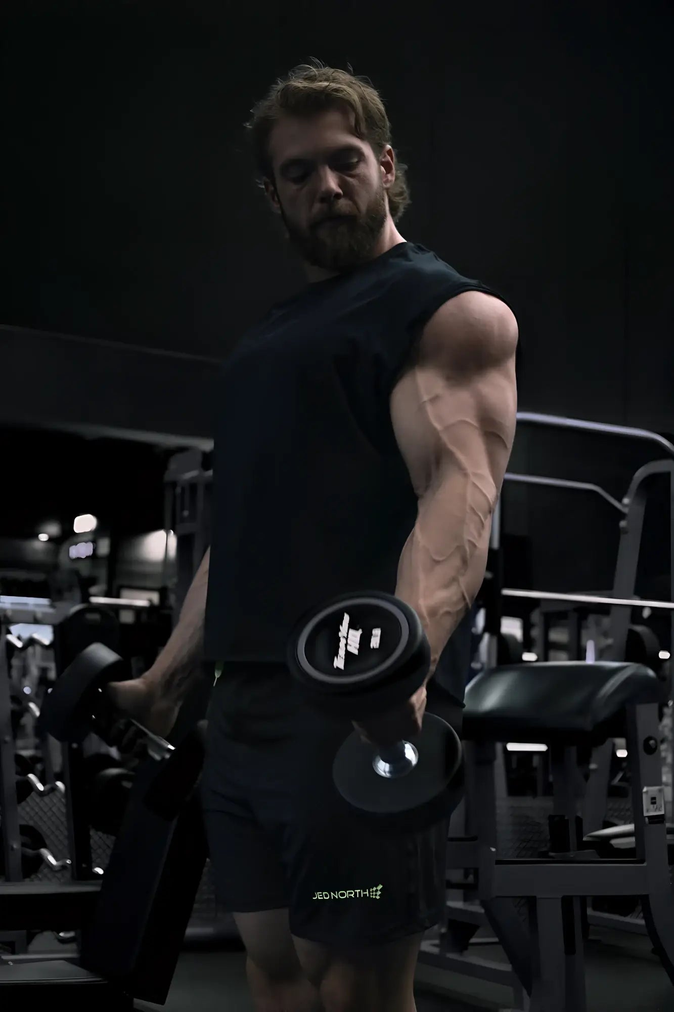 Black dumbbell with white logo on weight plate featured with raglan sleeveless muscle tank all black product
