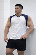 White and navy raglan sleeveless tank top with v-neckline and subtle black cursive text on the chest