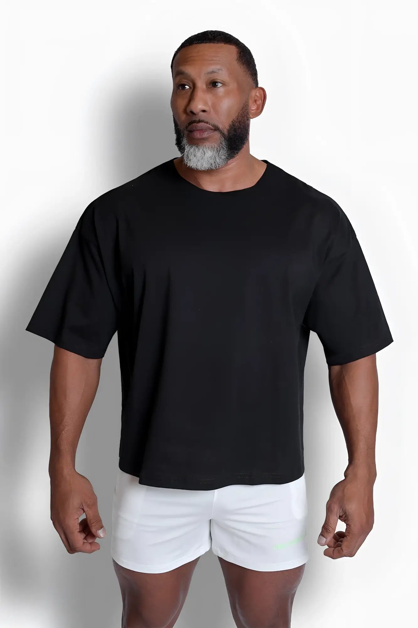 Black oversized raw-cut boxy crop tee with short sleeves made of soft cotton for casual wear