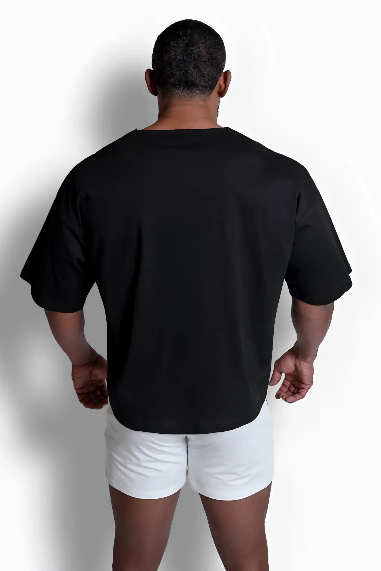 Black oversized raw-cut boxy crop tee with short sleeves and relaxed fit perfect for casual wear