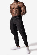 Black renegade cargo joggers with elastic waistband drawstring multiple side pockets and white logo on thigh
