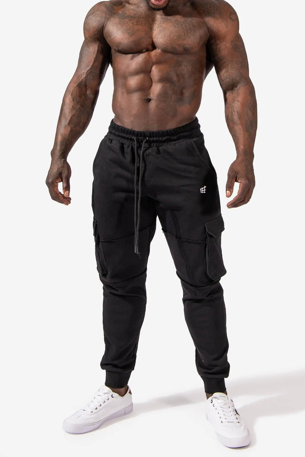 Renegade cargo joggers in black with elastic waistband drawstring multiple pockets and a subtle white thigh logo