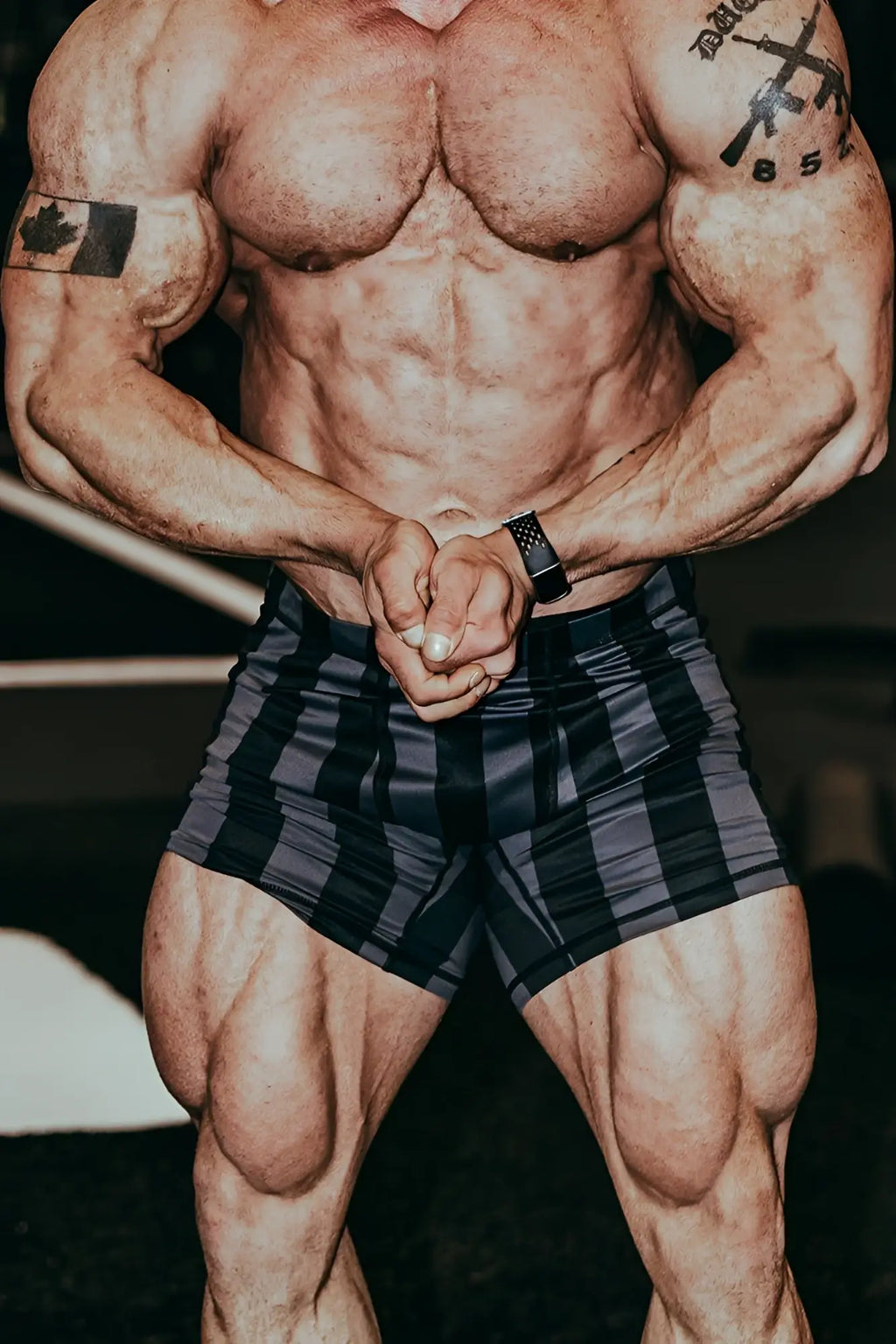 Retro bodybuilding shorts in black and gray plaid with a snug fit perfect for athletic use