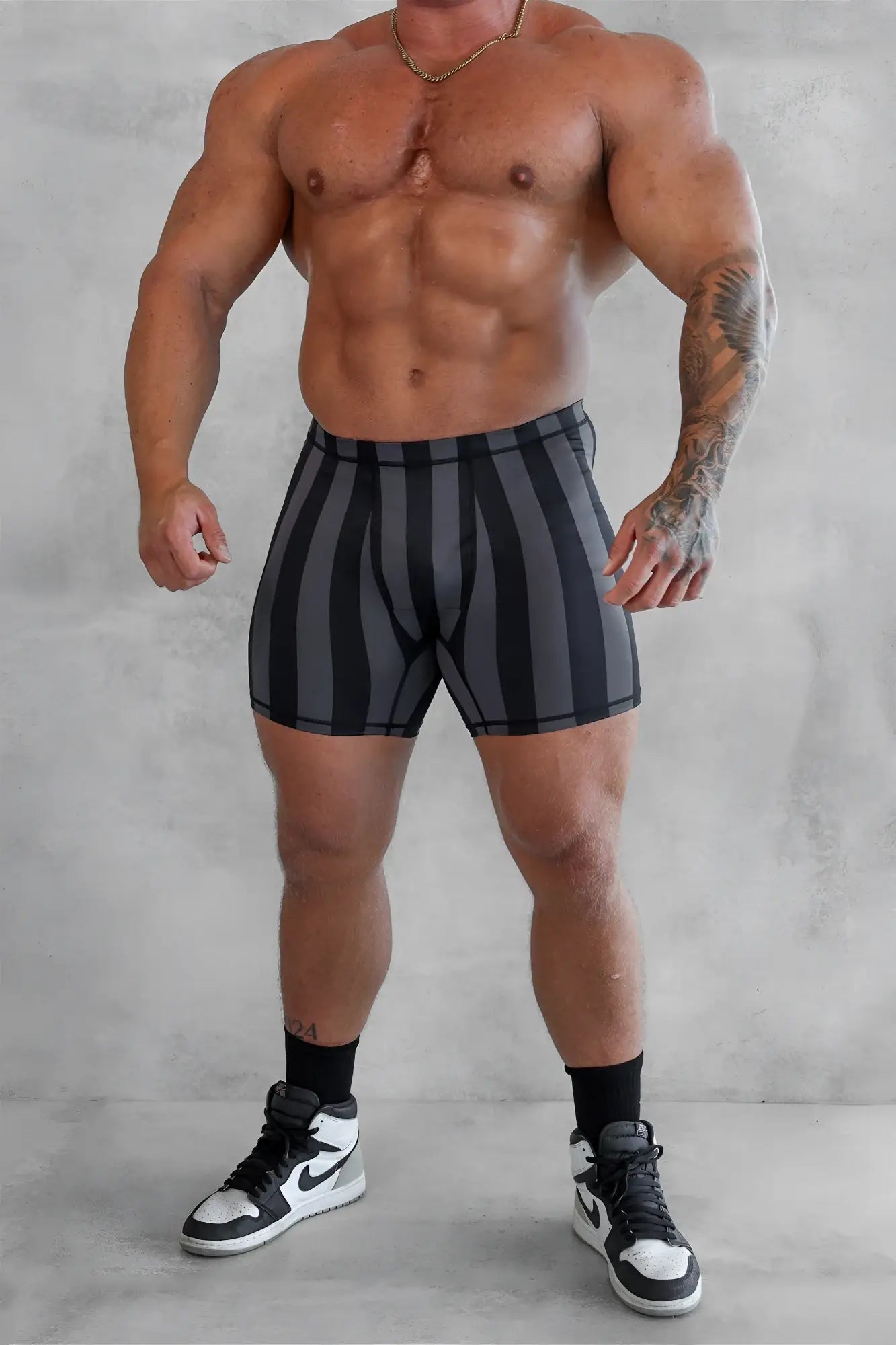 Retro bodybuilding shorts with black and gray vertical stripes made for athletic use in breathable fabric