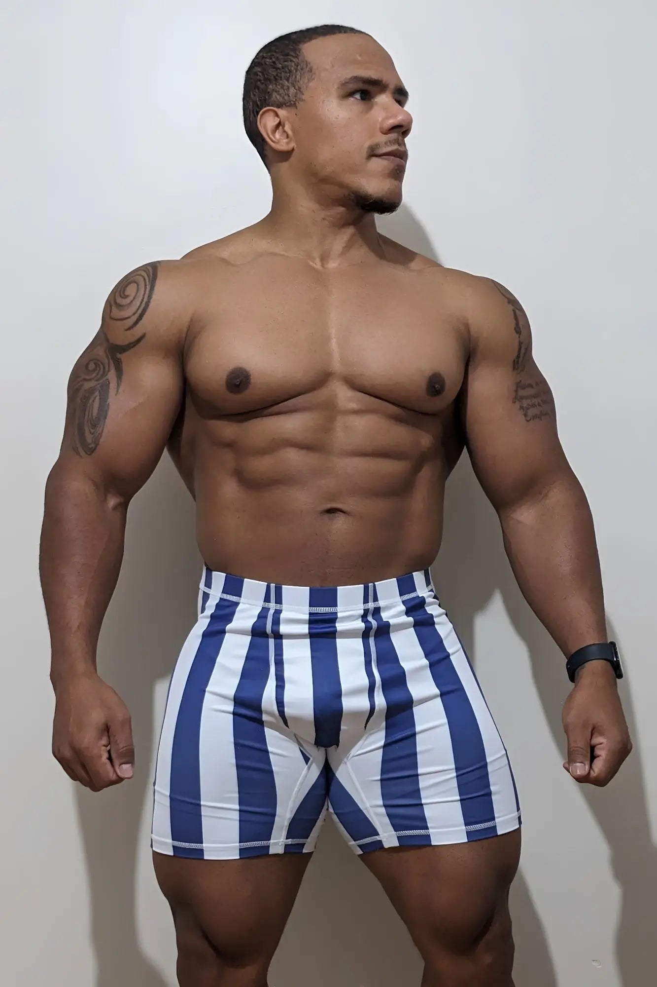 Retro bodybuilding shorts in blue and white vertical stripes designed for athletic use
