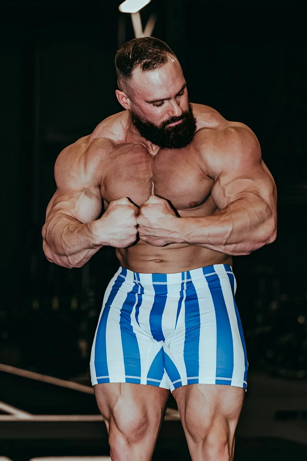 Retro bodybuilding shorts featuring blue and white vertical stripes designed for athletic use