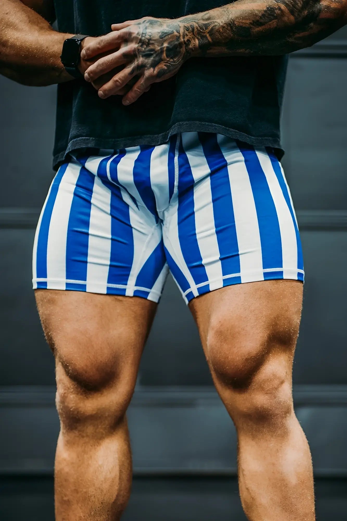Retro bodybuilding shorts with blue and white vertical stripes designed for athletic use in lightweight fabric