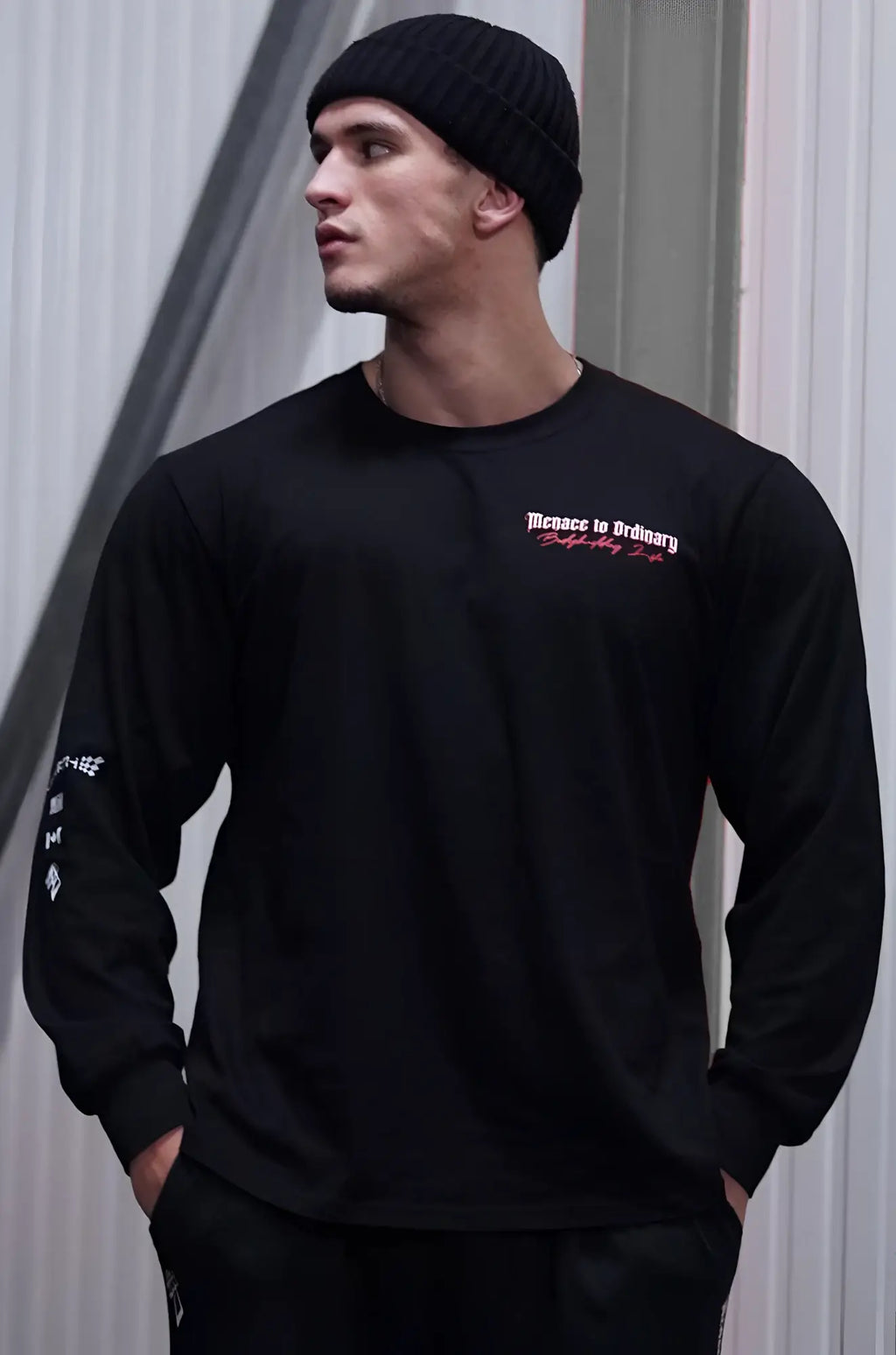 Jed North retro gym black long sleeve crewneck t shirt with subtle pink embroidered text and logo on chest and sleeve