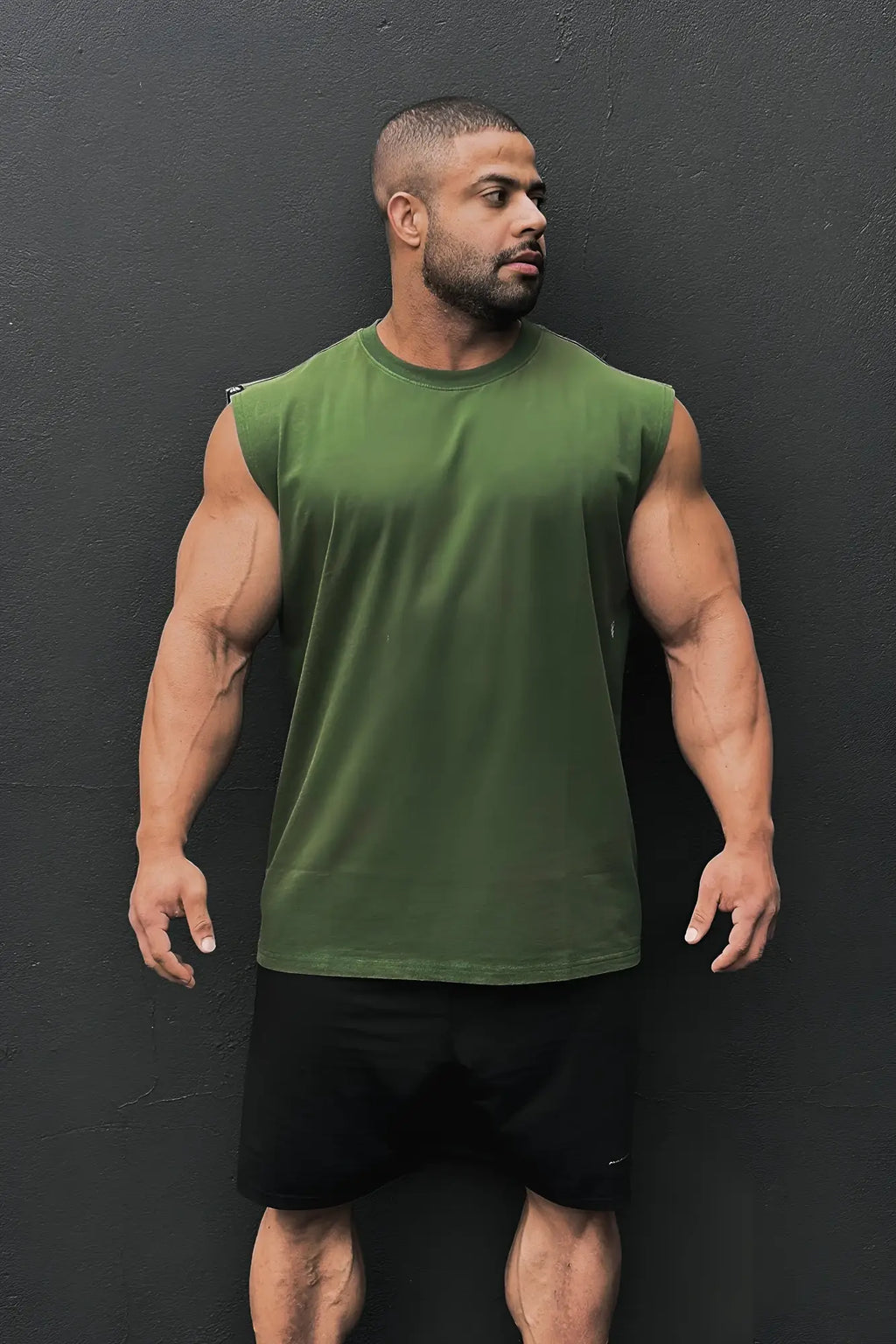 Olive green sleeveless cotton t-shirt with crew neck retro oversized muscle tee in forest green color