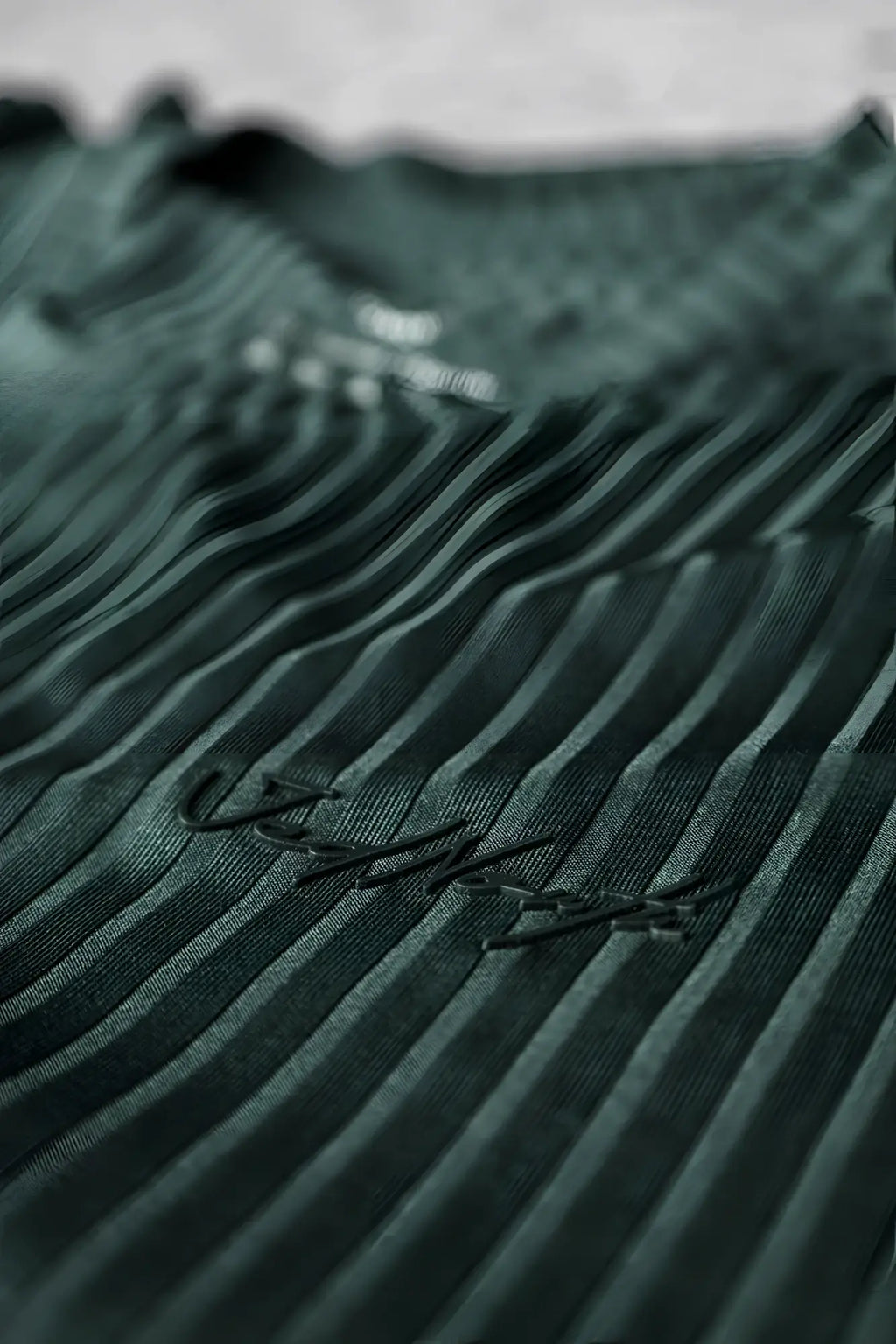Dark green ribbed knit jed north muscle-fit t-shirt with subtle black embroidered logo in forest green