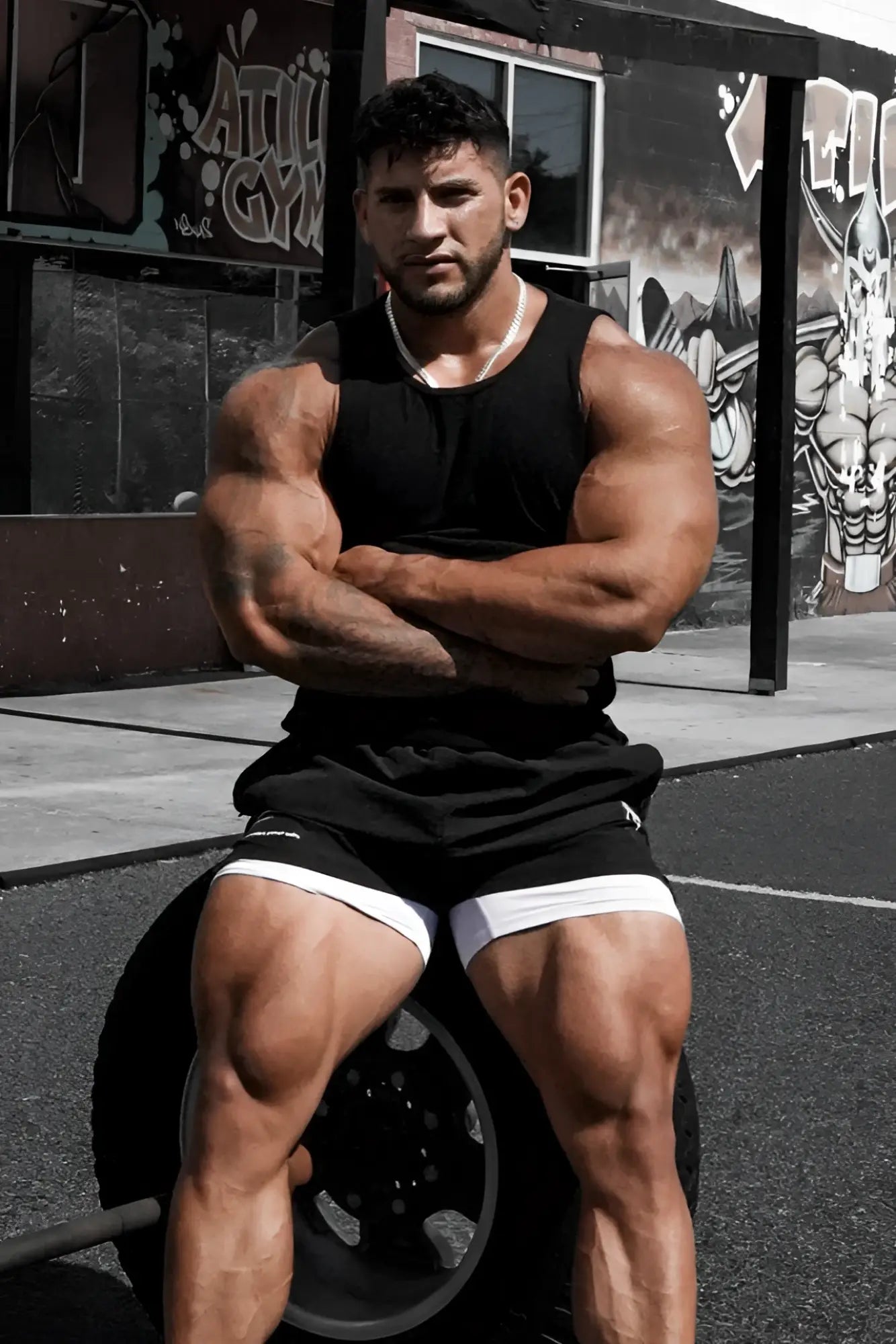 Black ribbed muscle tank top with white side trim sleeveless and made from stretch fabric for casual wear
