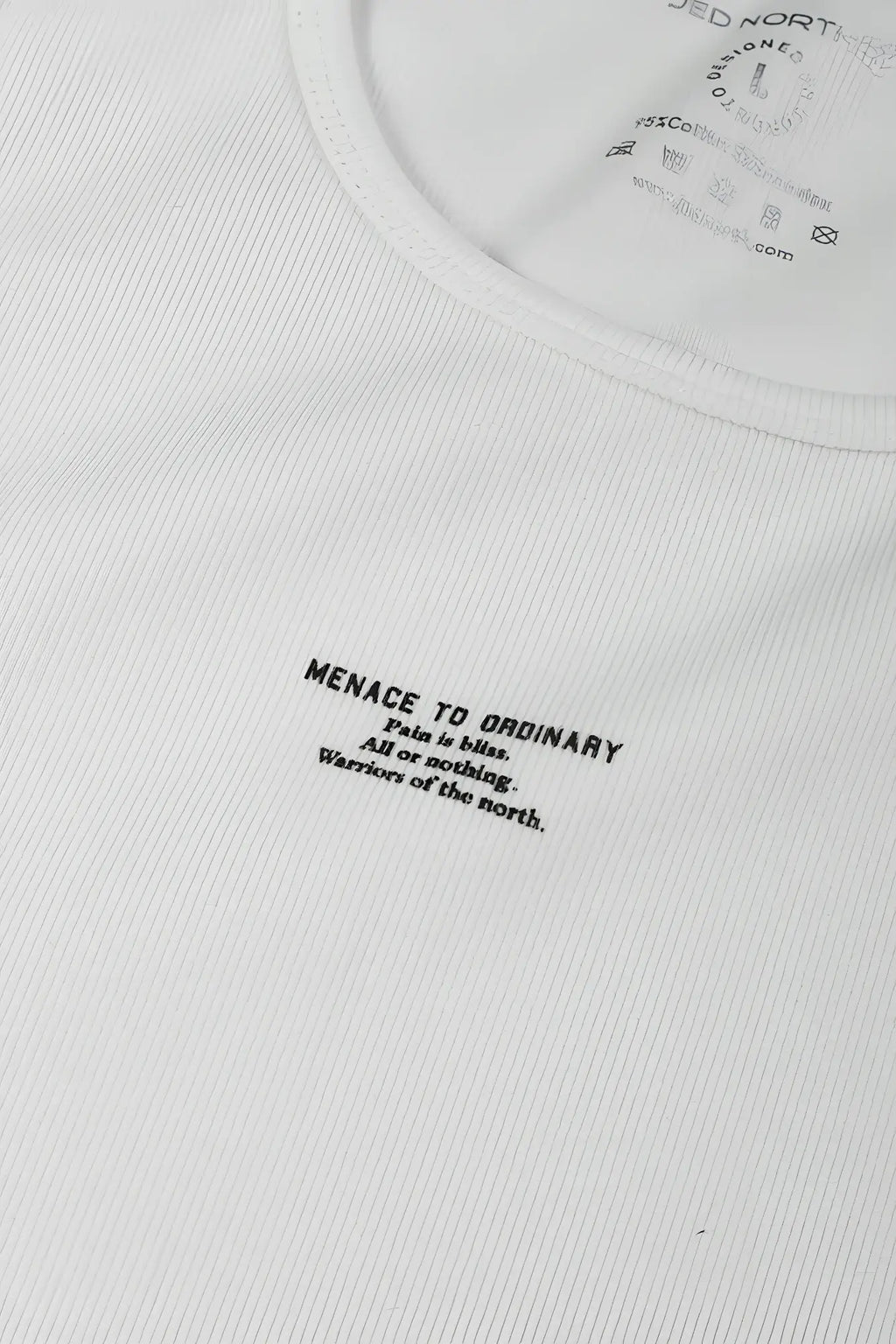 White ribbed cotton muscle tank top with black menace to ordinary print and jed nort tag at the neckline