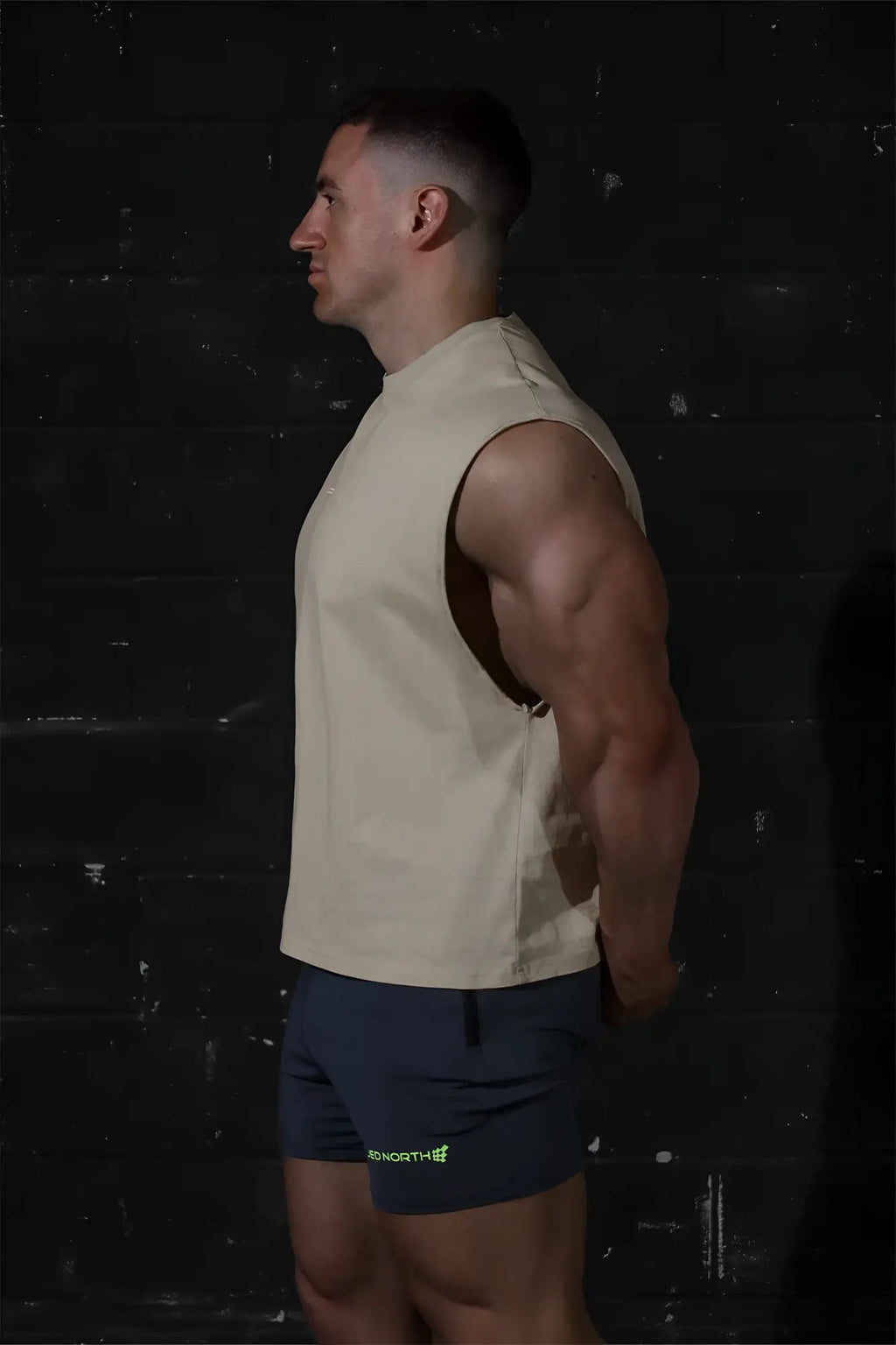 Beige sleeveless Jed North athletic tank top with high neckline and minimalist design in light khaki color