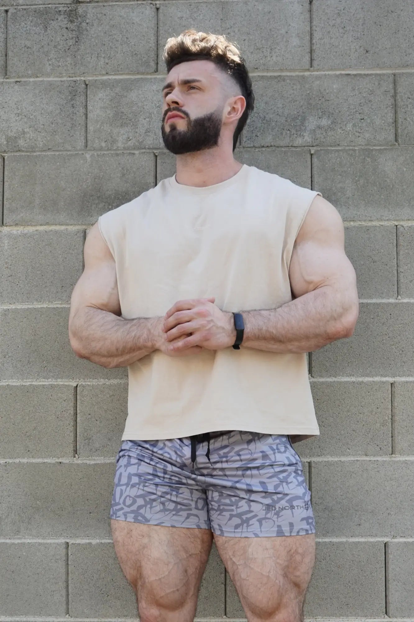 Beige sleeveless athletic top with simple crew neckline by jed north in light khaki for active wear