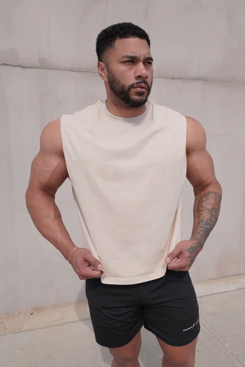 Cream-colored jed north sleeveless box cut tank top with relaxed fit and soft fabric in light khaki