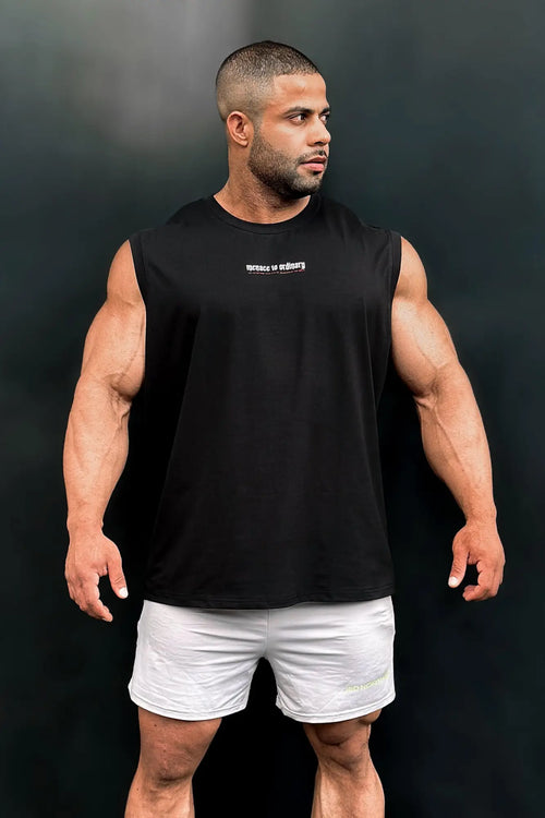 Black sleeveless athletic cotton muscle tee by Jed North with a small white logo on the chest for workout wear