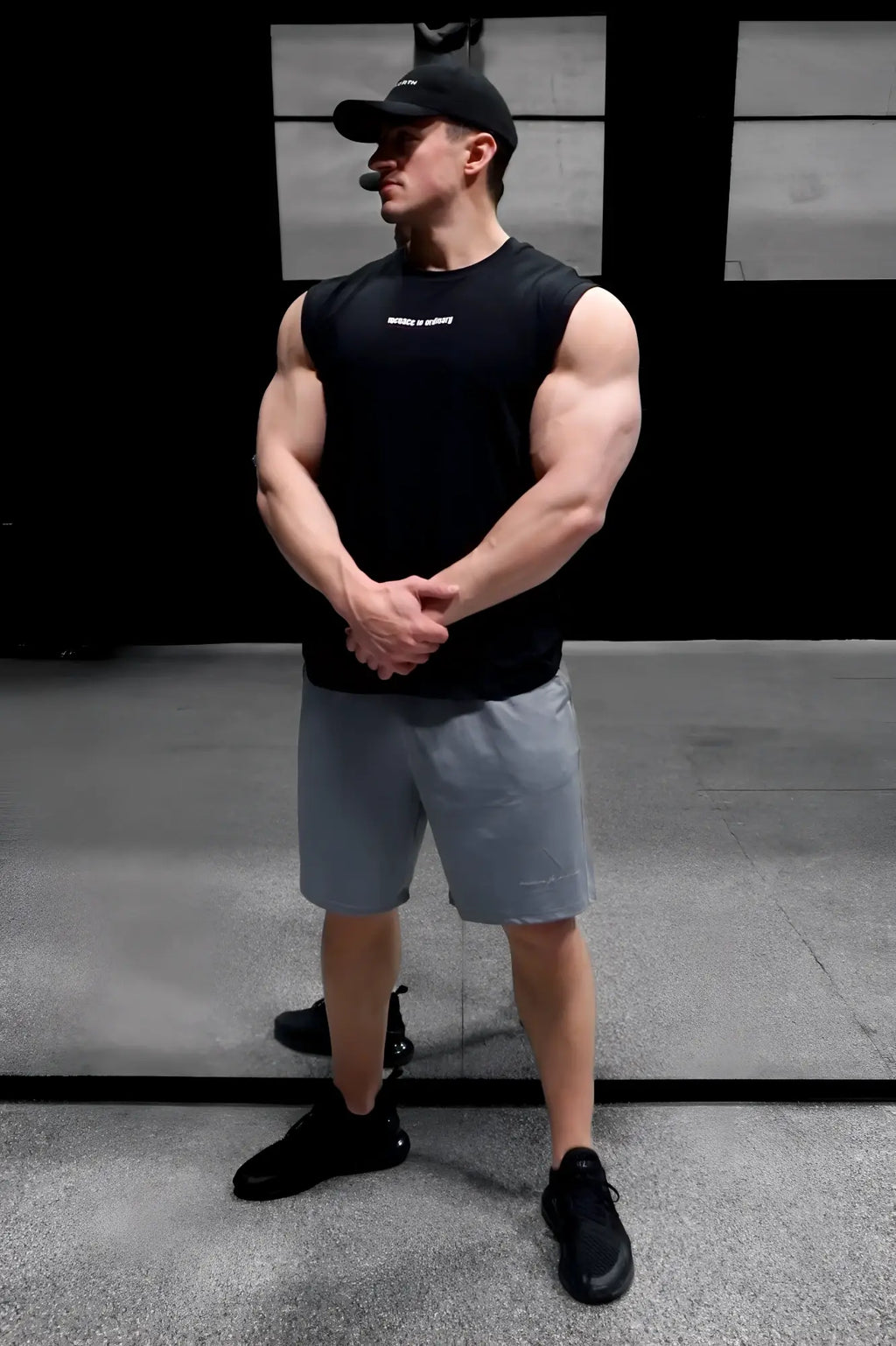 Black sleeveless athletic tank top with a small white logo on the chest Jed North sleeveless muscle tee