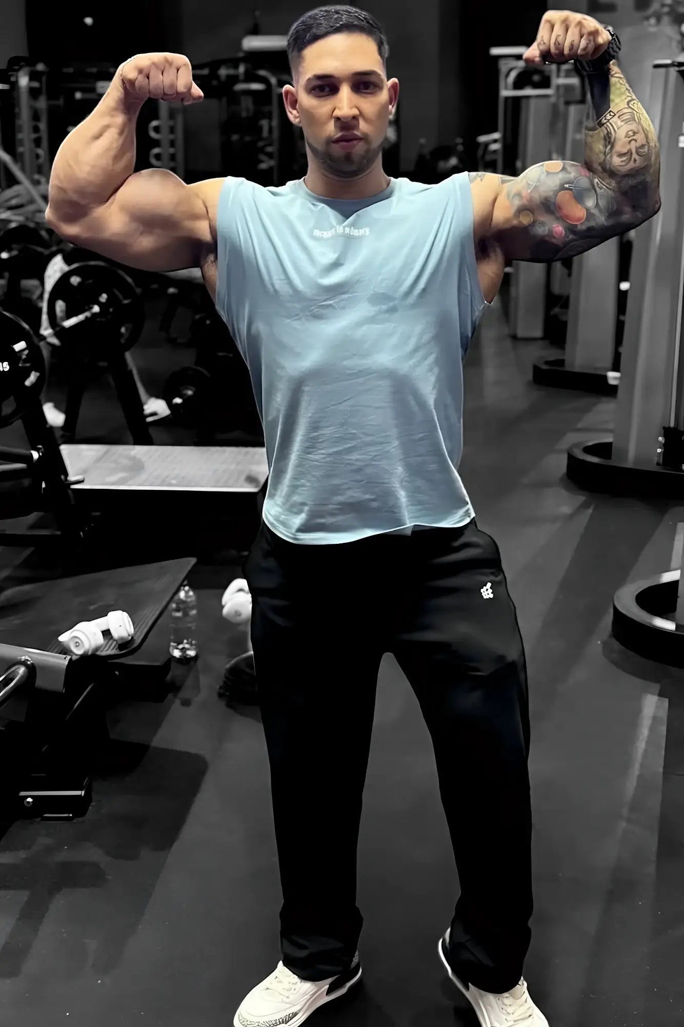 Light blue sleeveless athletic muscle tee by Jed North with a small white logo on the chest for workout use