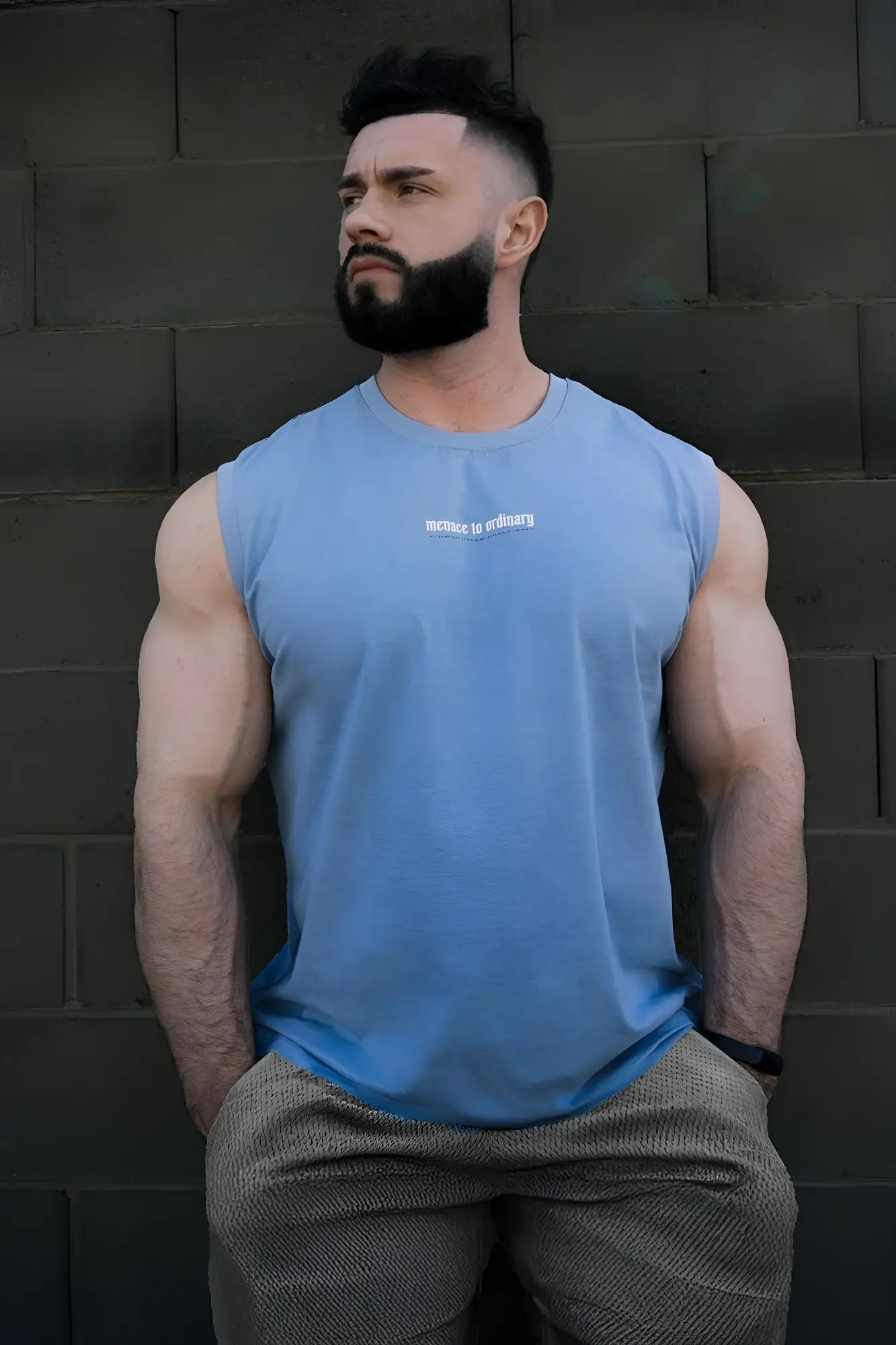 Light blue sleeveless muscle tee by jed north featuring white chest text perfect for workouts or casual wear