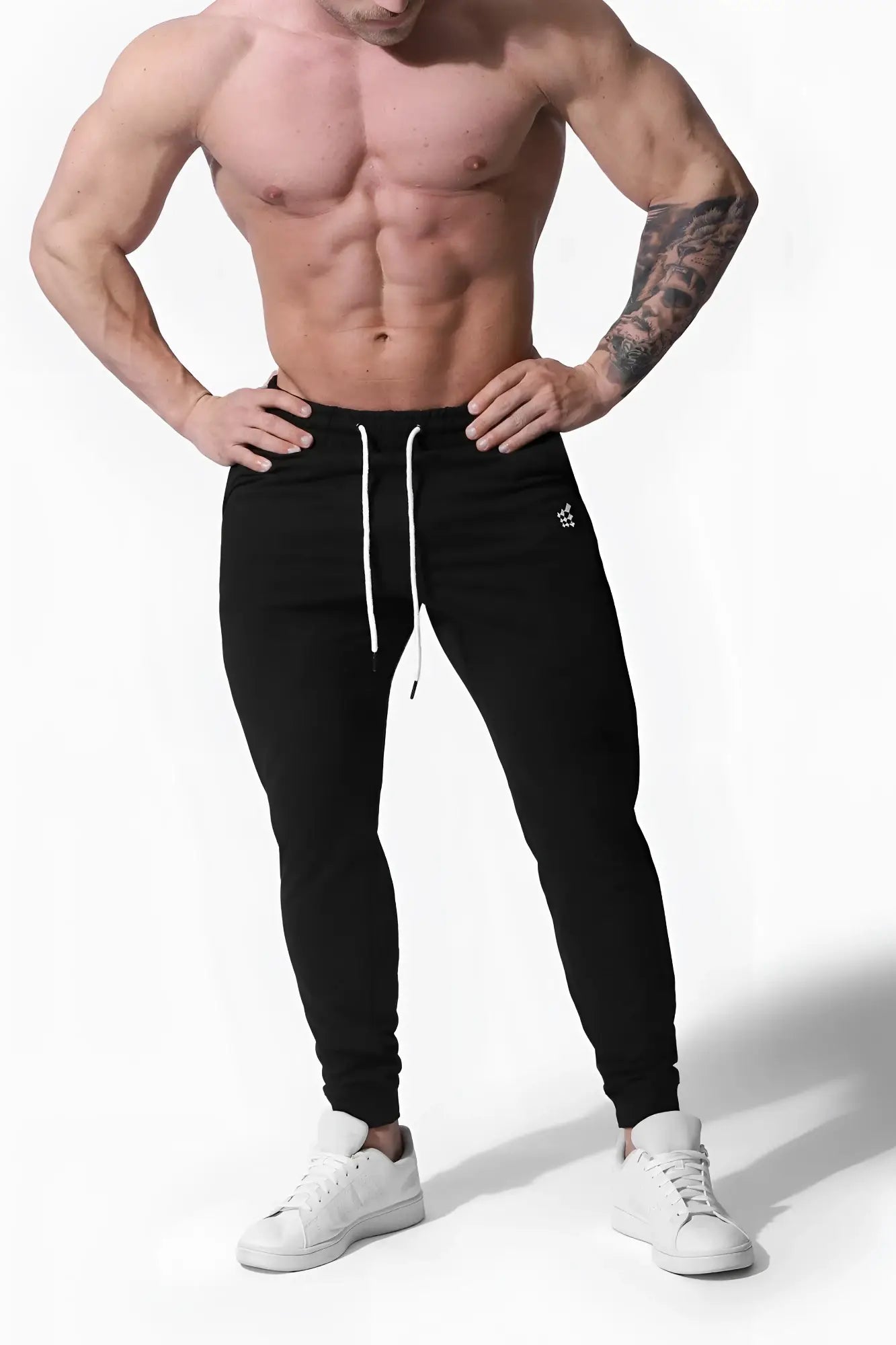 Black spirit joggers with white drawstrings and a small logo on the left thigh ideal for athletic wear