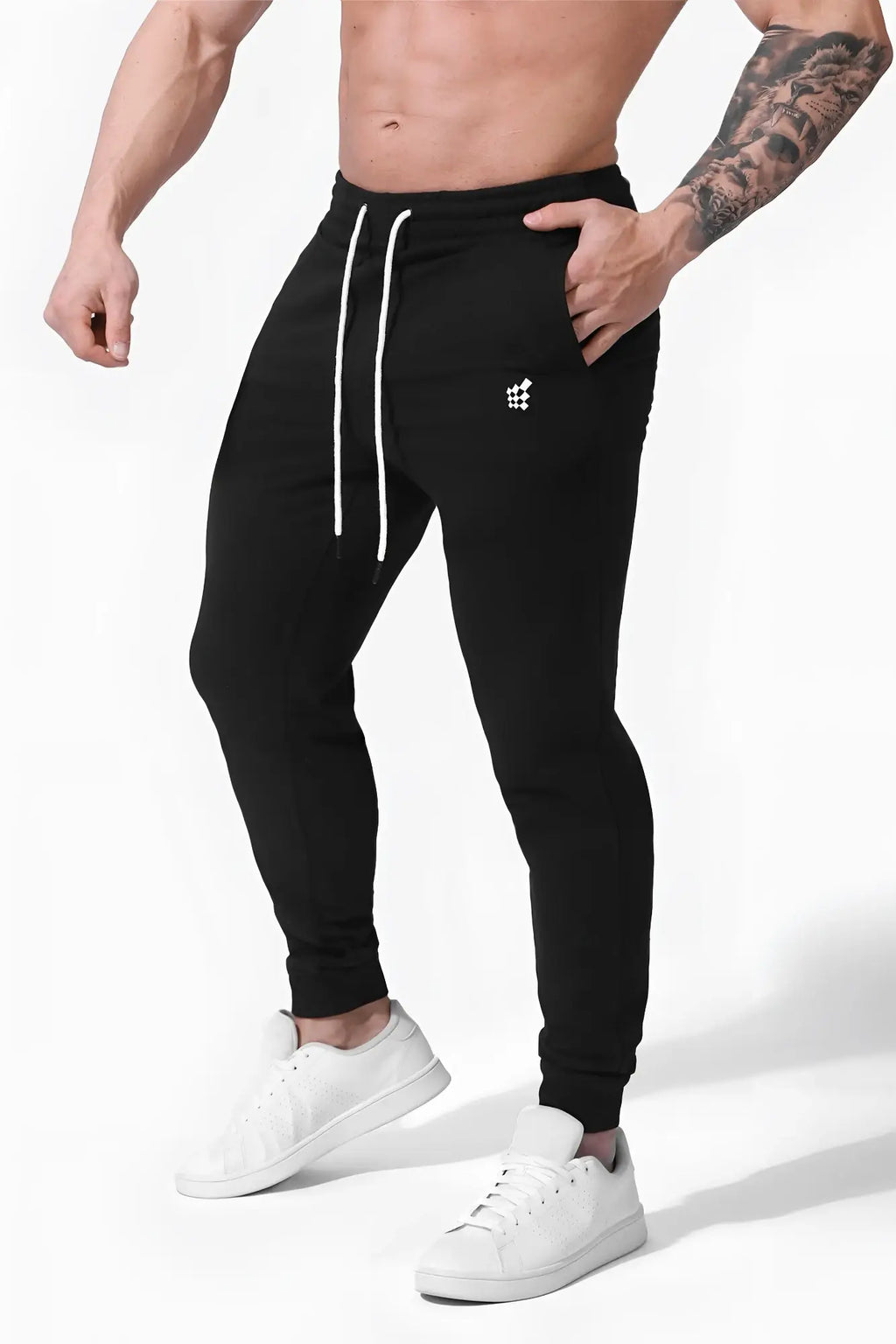 Black spirit joggers with white drawstrings and a small white logo on the left thigh made of comfortable fabric