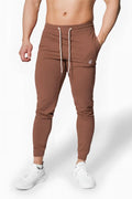 Jed North Spirit joggers in brown featuring white drawstrings and a small embroidered logo on the thigh