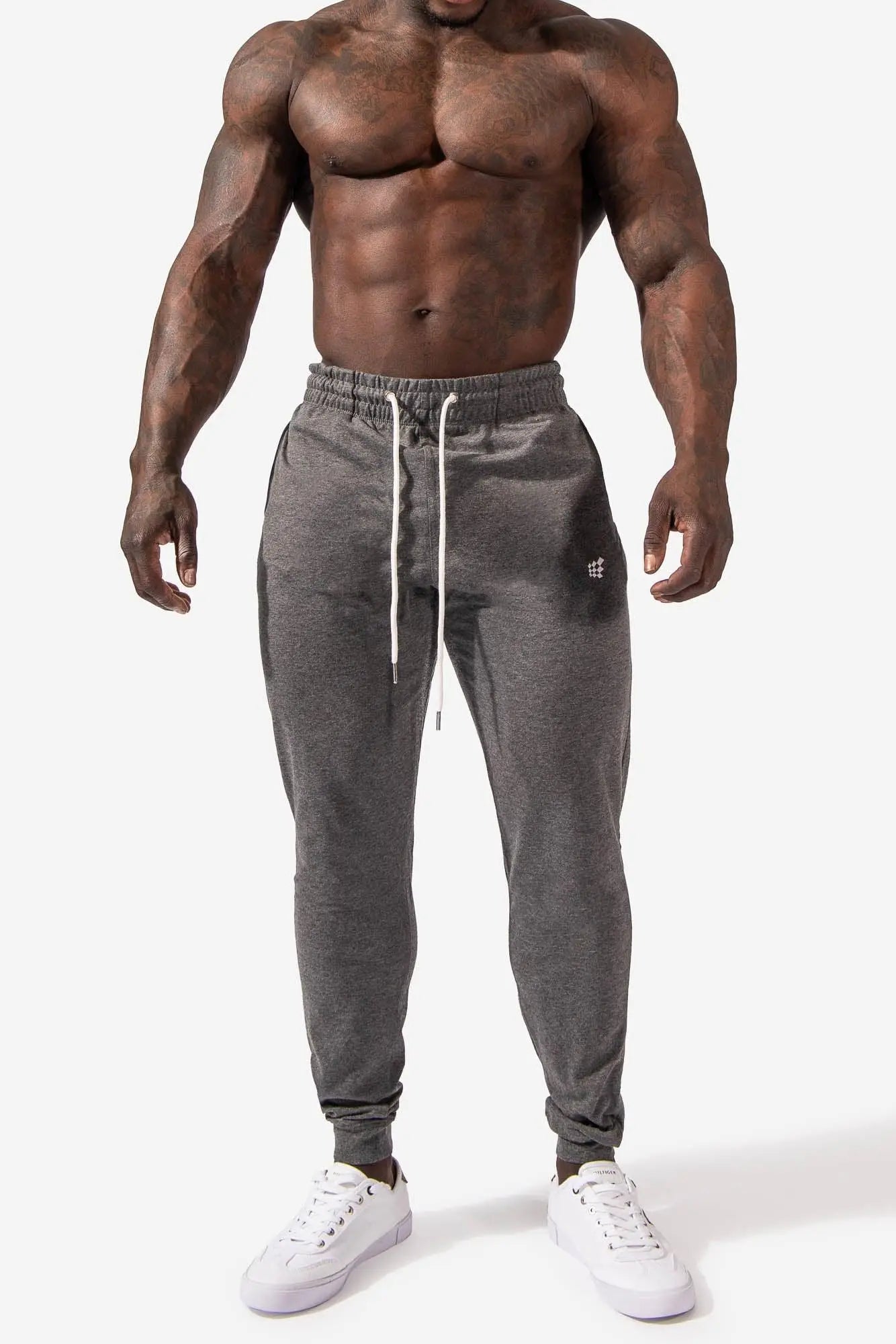 Spirit joggers dark gray heathered jogger pants with white drawstrings and small logo on left thigh