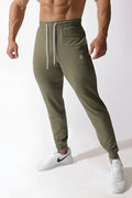 Olive green Jed North Spirit joggers with white drawstrings and embroidered logo on left thigh in comfortable fabric