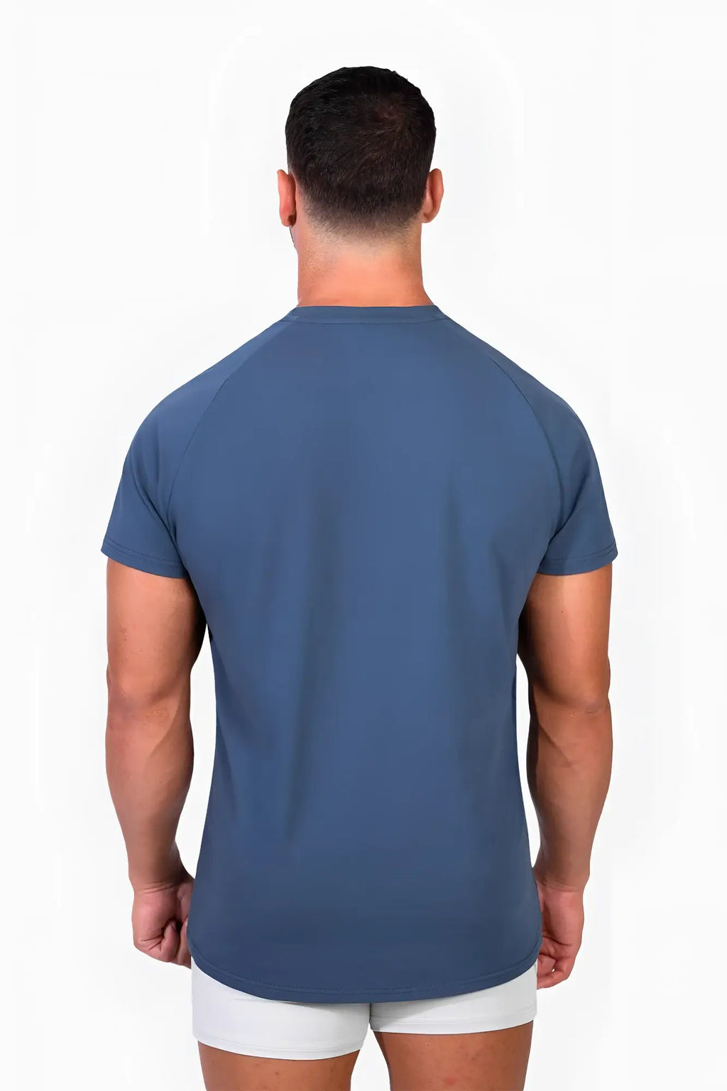 A men’s short-sleeved jed north titan 2.0 muscle-fit athletic tee in solid dark teal with raglan sleeves and crew neckline