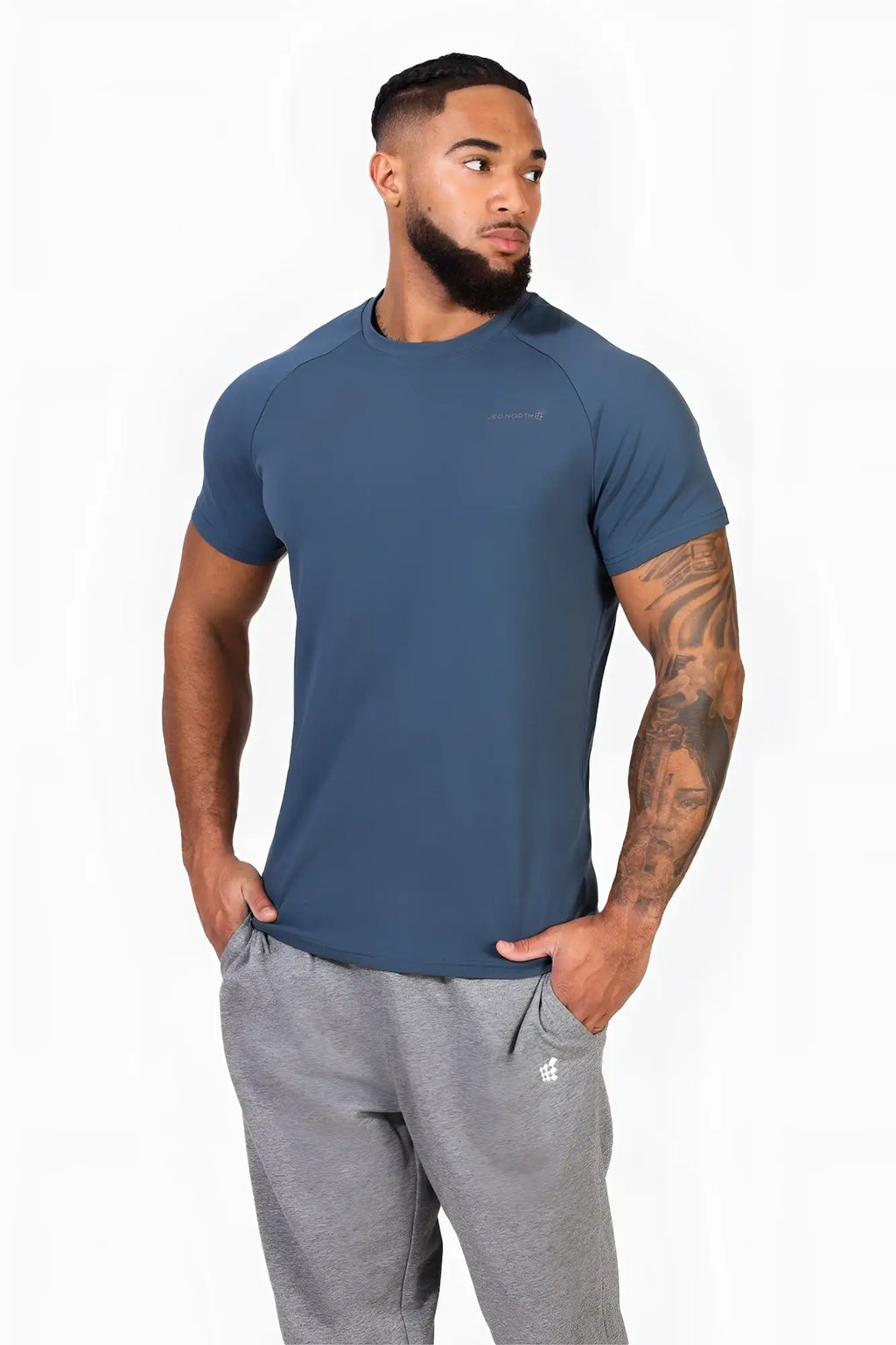 A sleek dark teal jed north titan 2.0 muscle-fit short-sleeved t-shirt with a subtle chest logo for athletic use