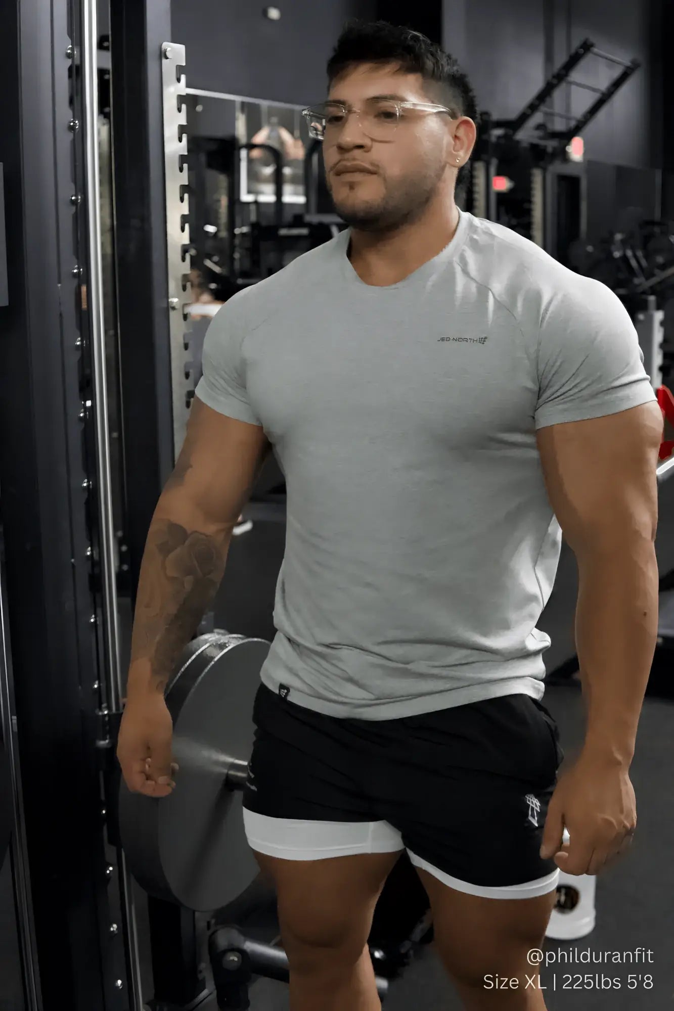 Gray short-sleeved muscle-fit athletic t-shirt by jed north with small chest logo in heather gray color