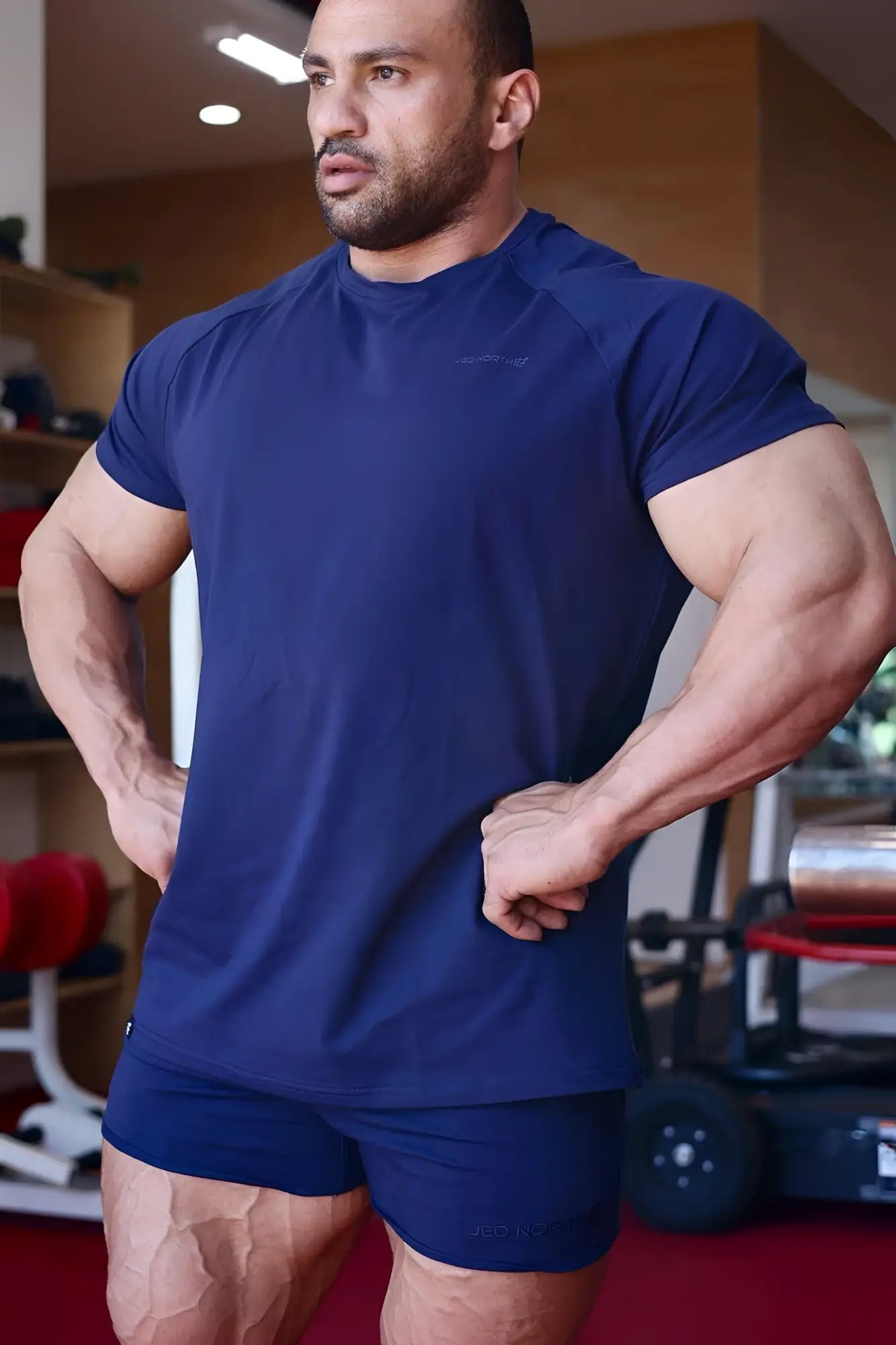 Navy blue jed north titan 2.0 muscle-fit short-sleeved t-shirt with subtle chest logo paired with matching shorts
