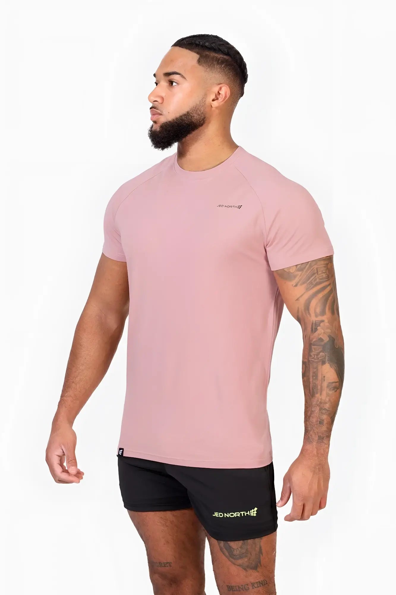 Jed north titan 2.0 muscle-fit soft pink athletic t-shirt with subtle logo paired with black branded shorts