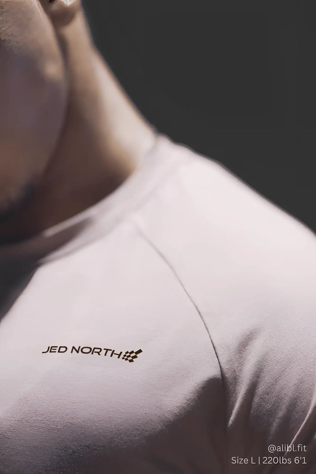 White jed north titan 2.0 muscle-fit t-shirt with black logo and checkered flag emblem on the chest