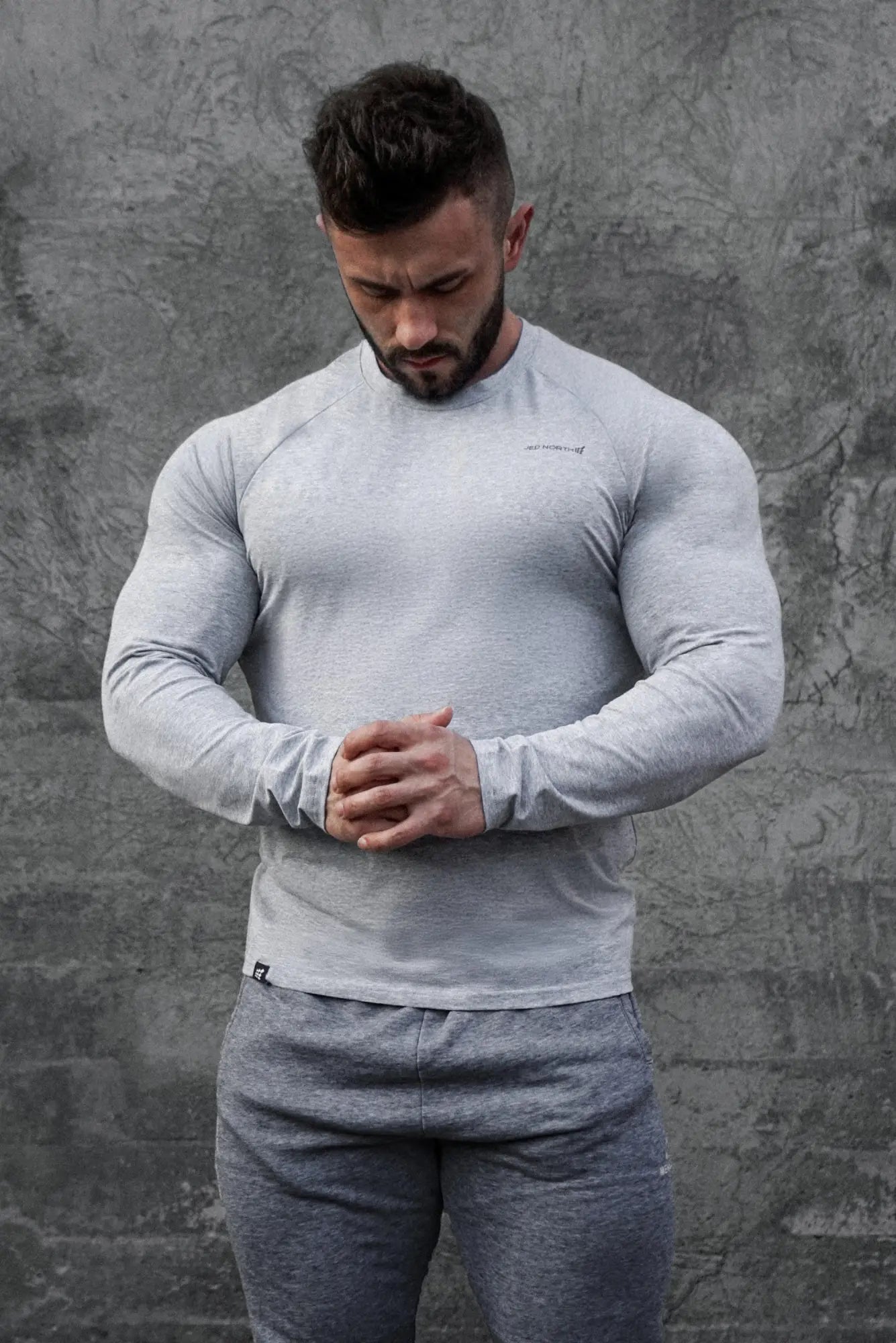 Gray jed north titan muscle-fit long sleeve t-shirt with subtle textured weave and minimal chest branding platinum color