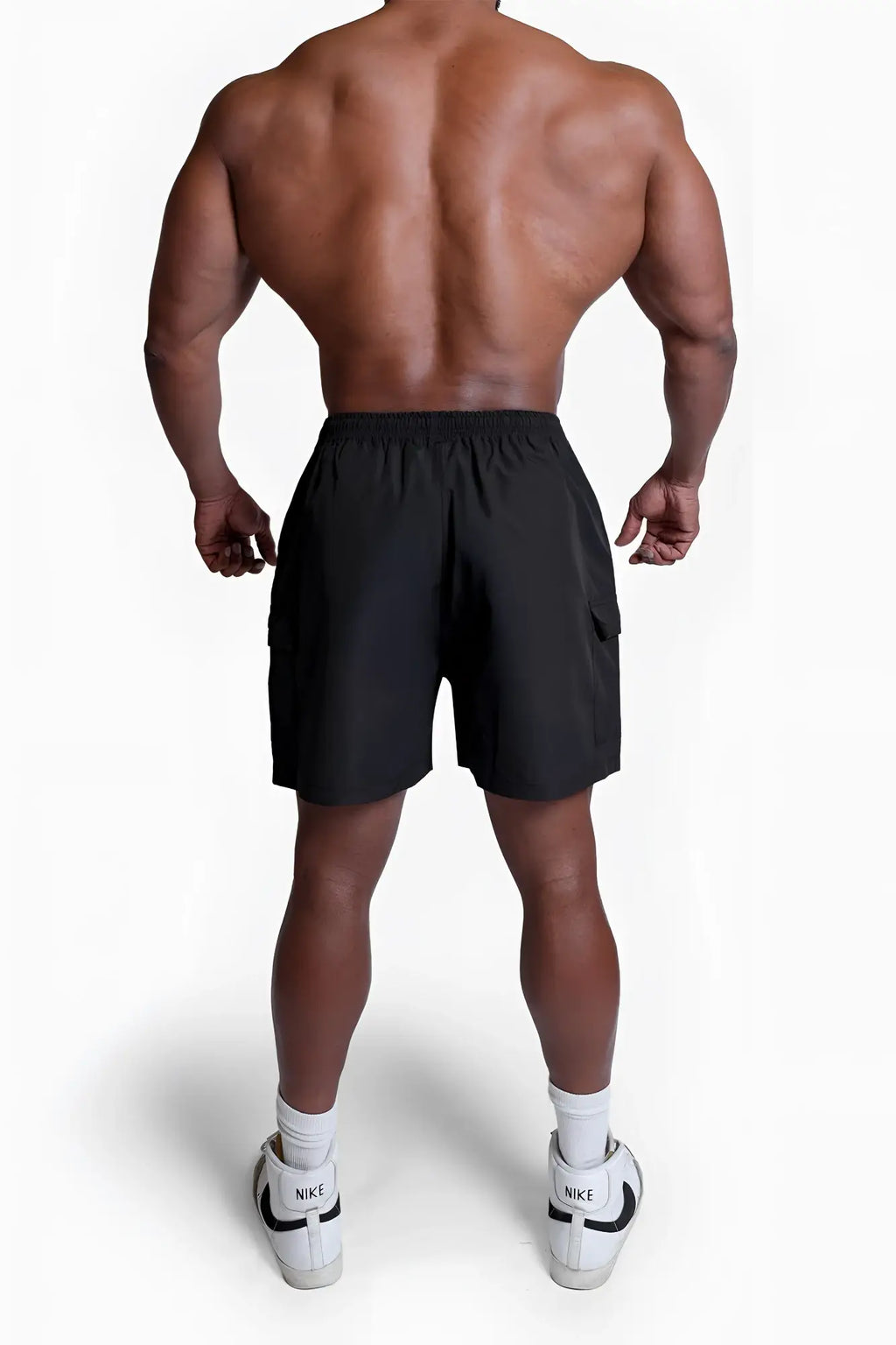 Black nike trek 4.5 inch cargo shorts with drawstring waistband and side pockets for athletic use