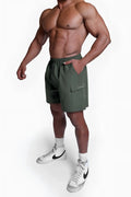 Trek 4.5 inch cargo shorts in dark olive with drawstring waistband and side pockets for outdoor wear