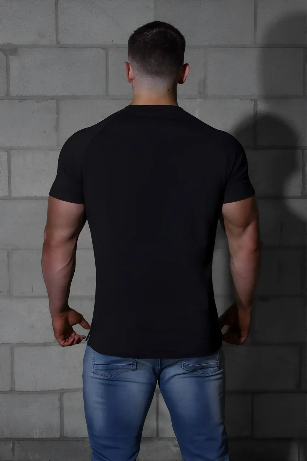 Black short-sleeved fitted crew neck t-shirt by jed north in a muscle-fit design perfect for active wear