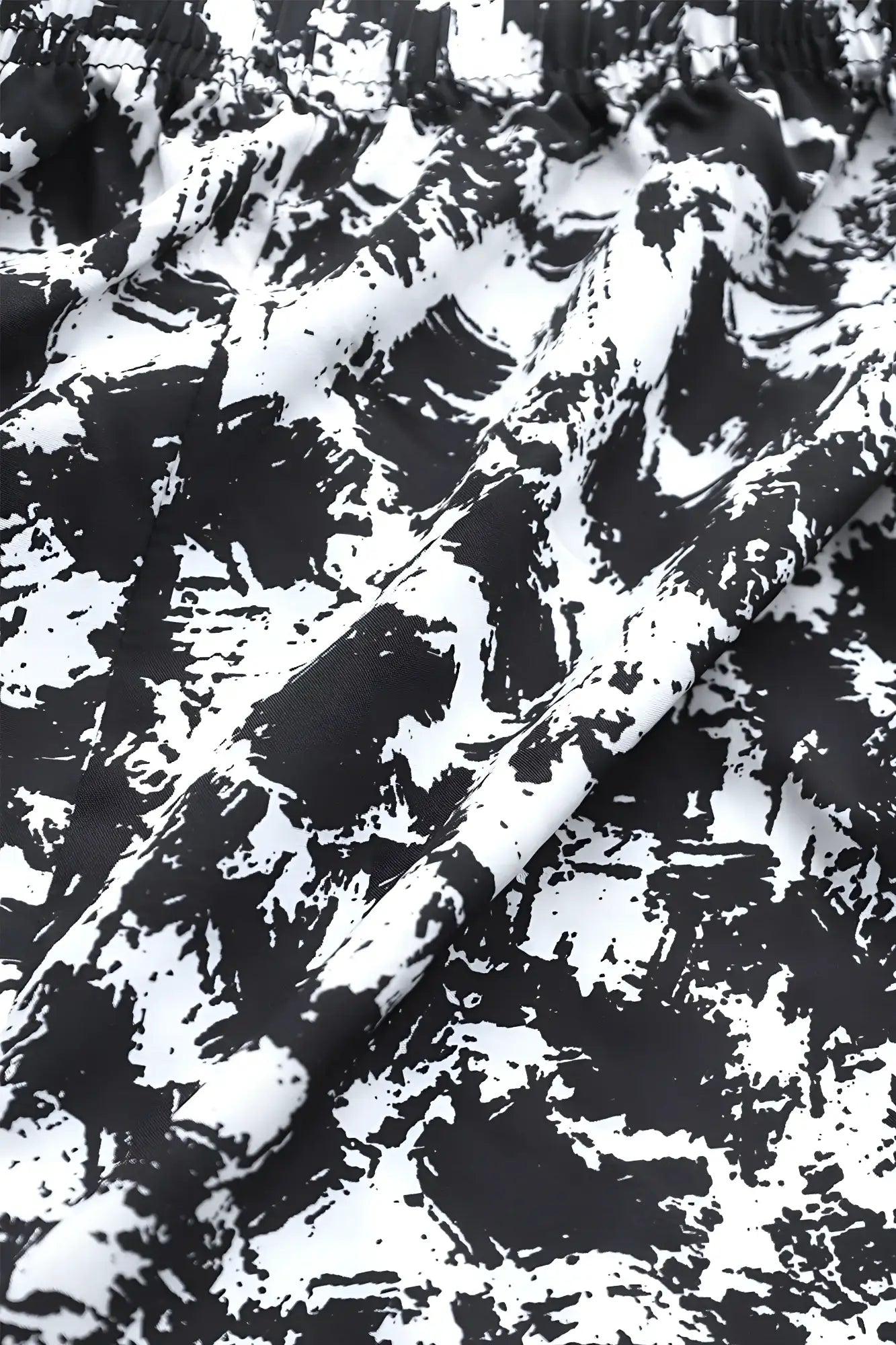 Jed north vintage flex joggers with black and white paint splatter pattern on soft flowing fabric texture