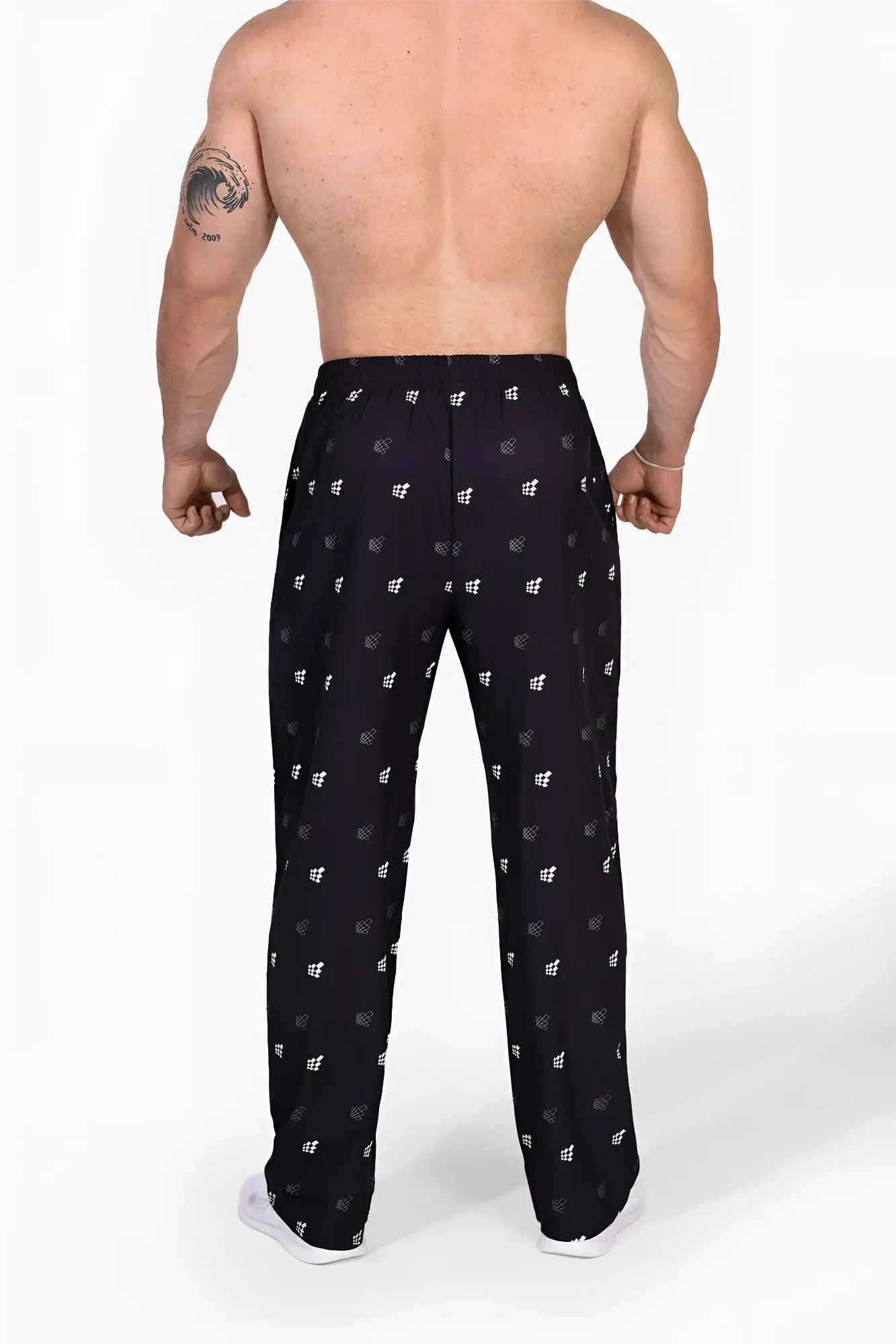 Black Jed North vintage flex joggers with a repeating white geometric pattern and Jed North logo for casual wear