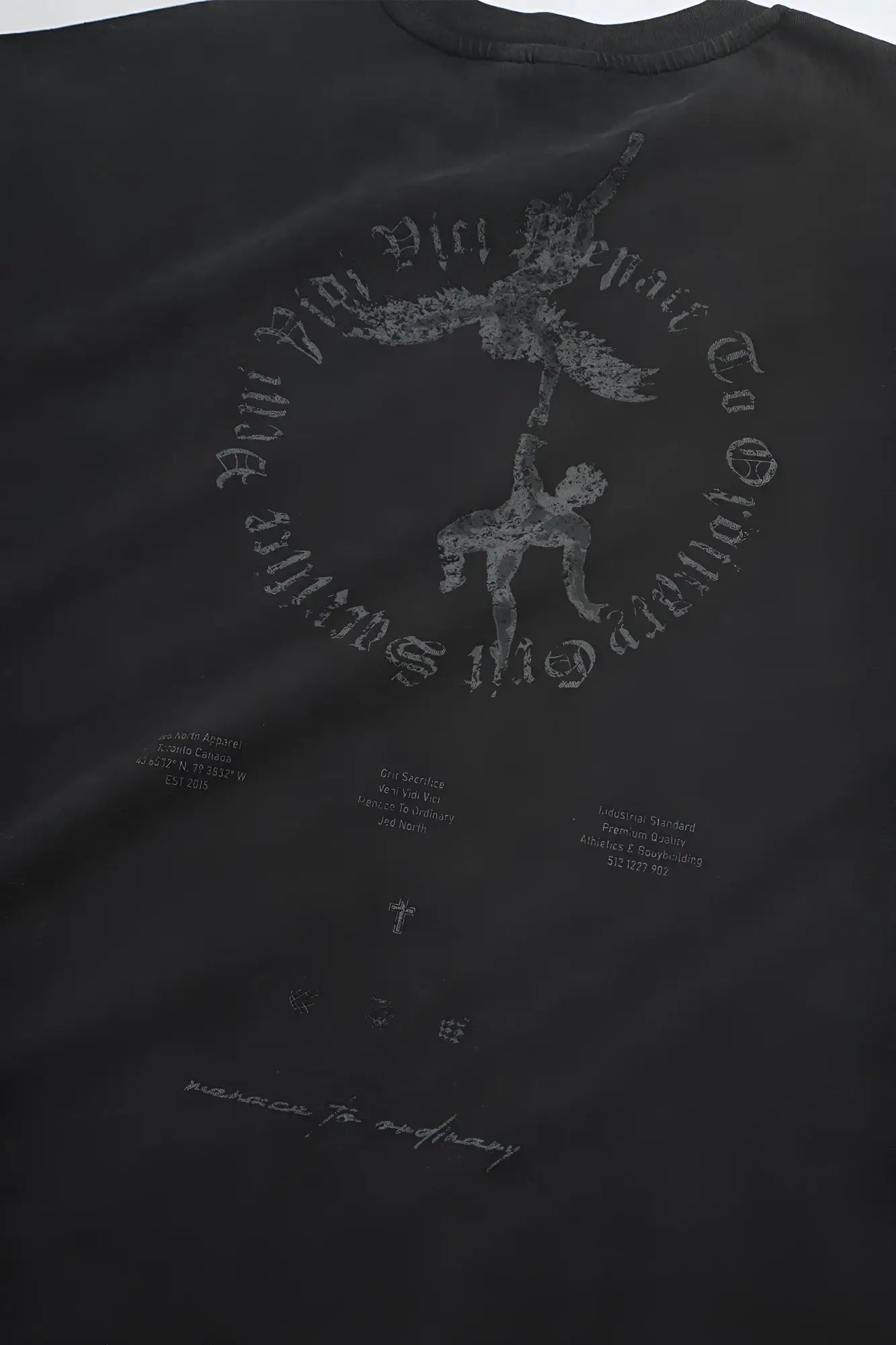 Black cotton vintage oversized t-shirt with faded gray guardian angel graphic and arching text on front