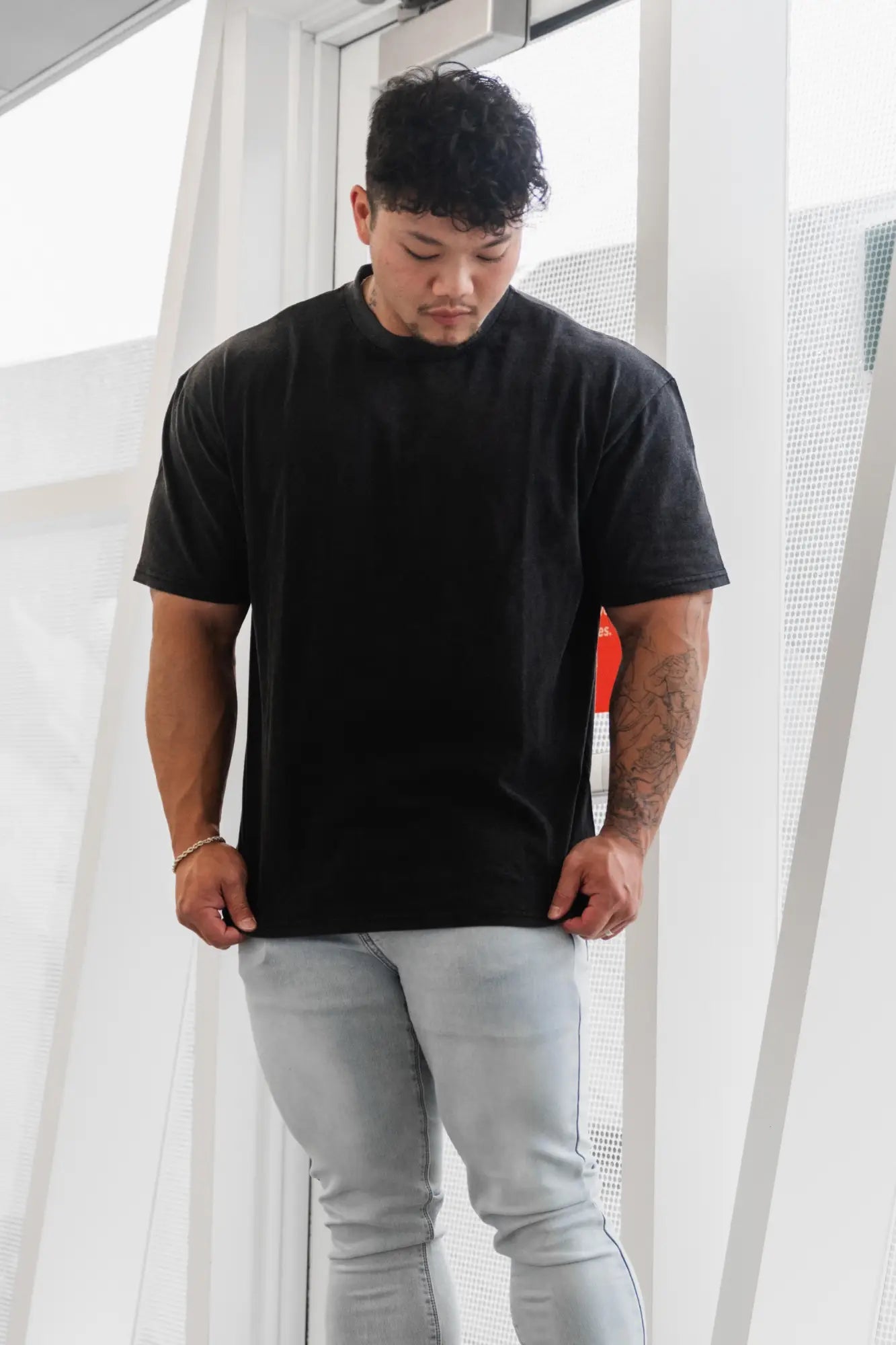 Black oversized cotton t-shirt by Jed North with relaxed fit and short sleeves featuring tigerus invictus 2.0 design